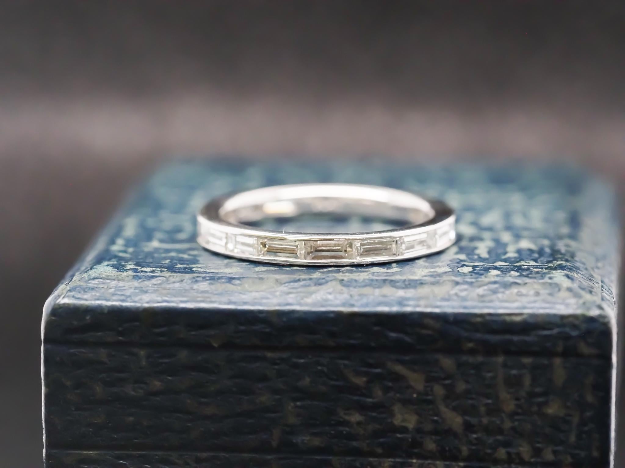 Item Details:
Ring Size:  6.25  (Sizable)
Metal Type: Platinum [Hallmarked, and Tested]
Weight: 3.2 grams
Diamond Details: Natural Diamonds, Baguette Shape, 1.75ct approx, F Color, VS Clarity
Band Width: 2.5mm
Condition:  Excellent