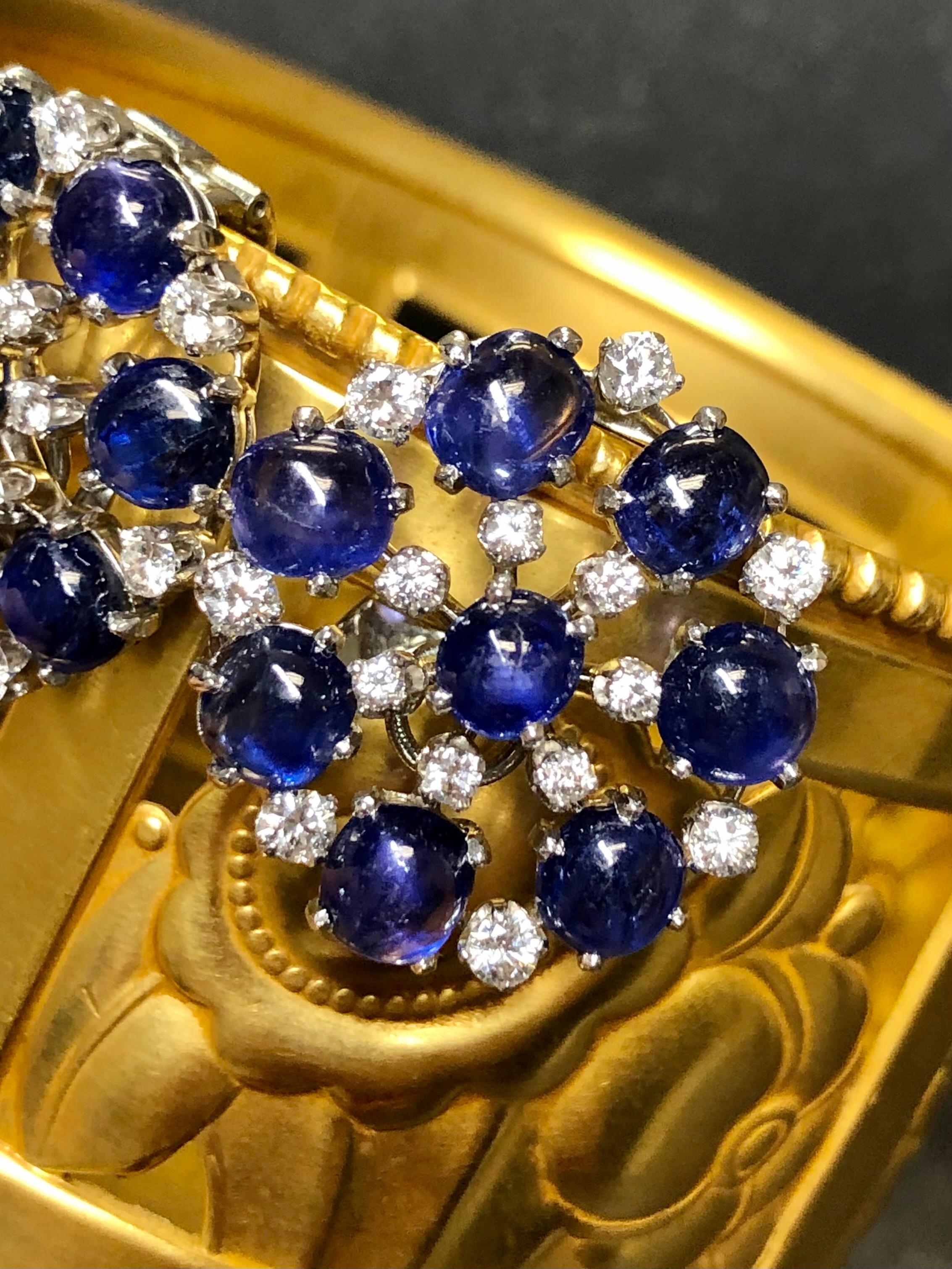 Gorgeous vintage earrings c. the 1950’s done in platinum (14K backs as tested) set with approximately 16cttw in natural

Cabochon sapphires averaging 1ct each. Separating the sapphire is approximately 1.80cttw in larger G-H color Vs diamonds. The