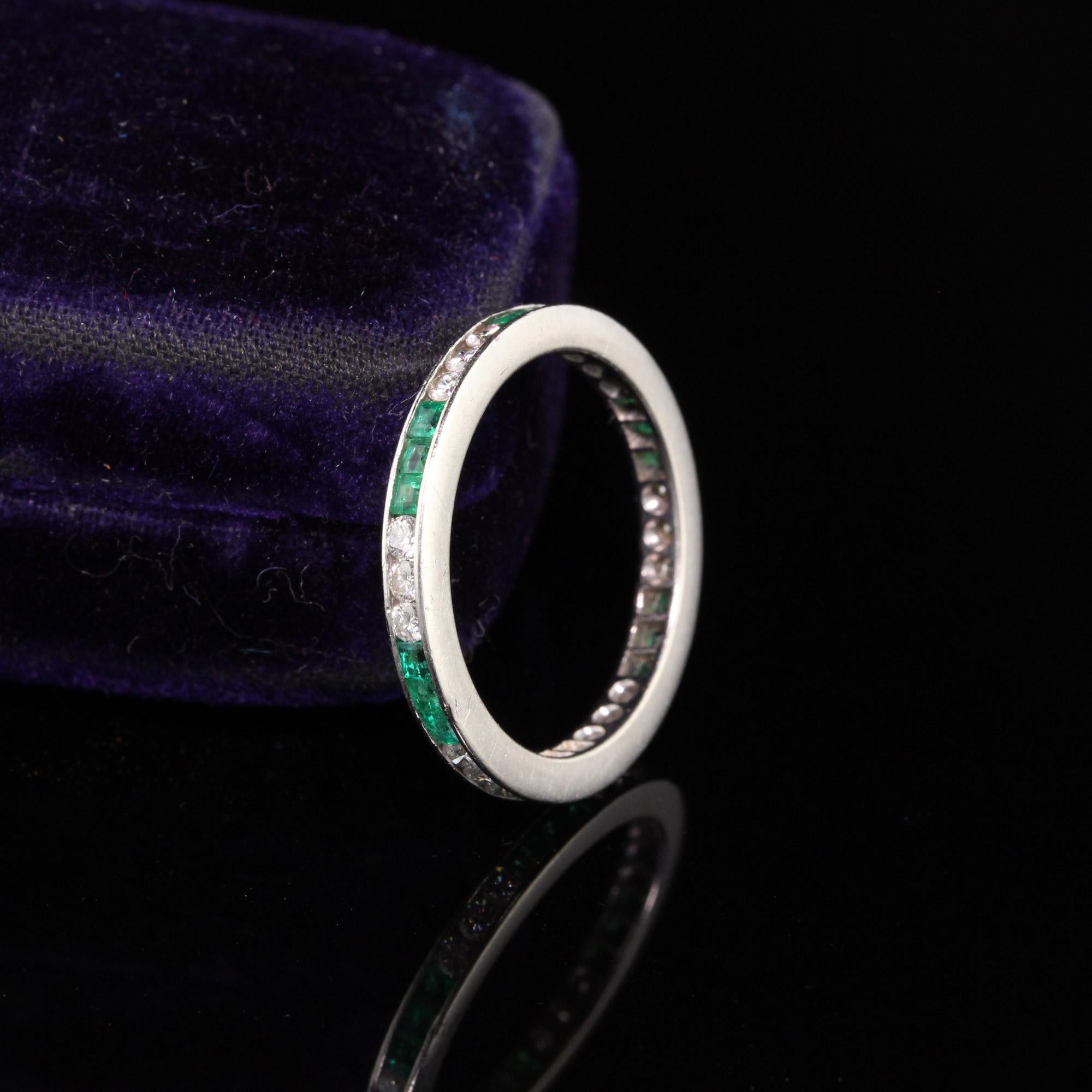 Beautiful Vintage platinum eternity band with emeralds and diamonds. 

Item #R0498

Metal: Platinum

Weight: 3.2 Grams

Total Diamond Weight: Approximately 0.50 cts

Diamond Color: H

Diamond Clarity: VS2 - SI1

Total Emerald Weight: Approximately