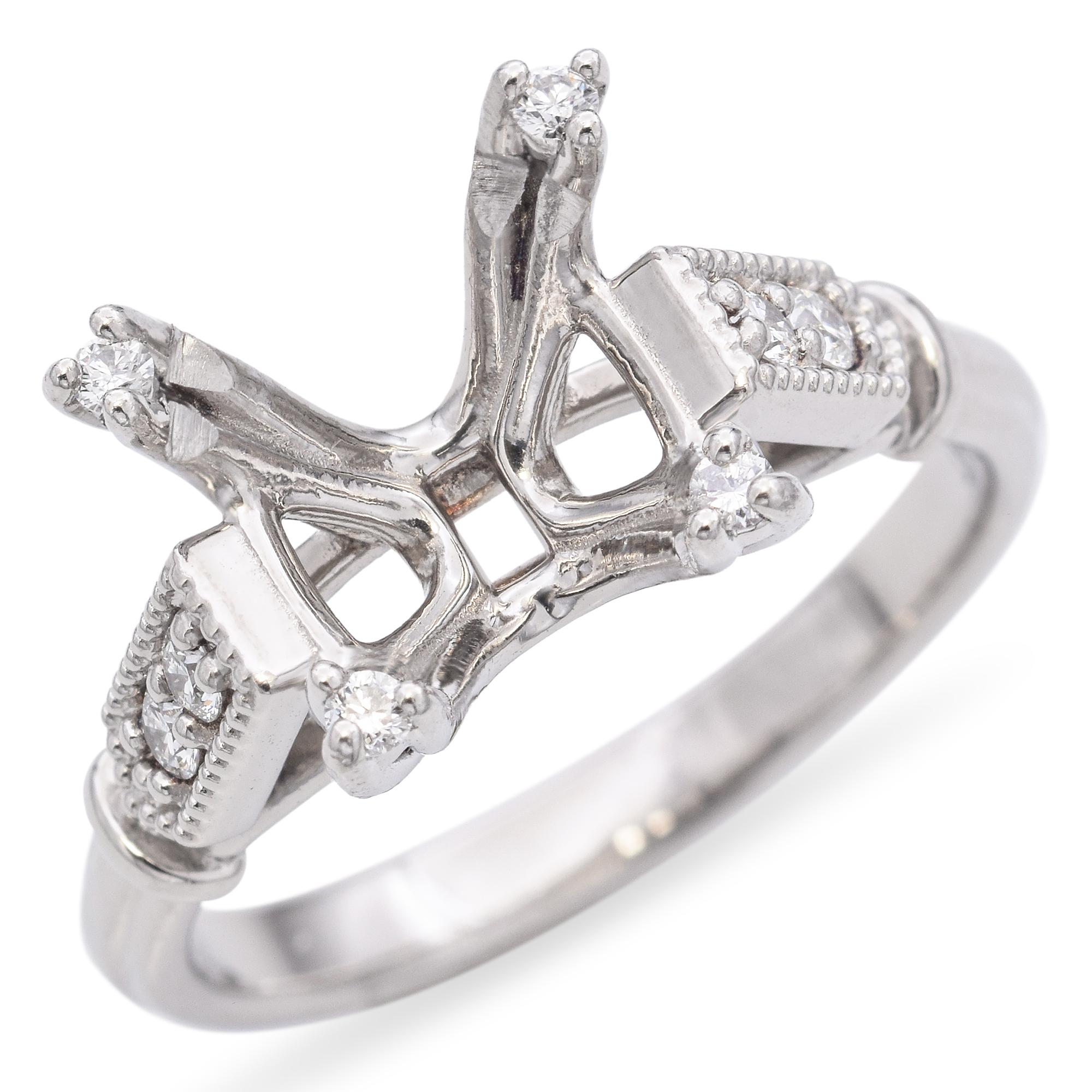 Experience refined elegance with our Platinum Engagement Ring. Crafted in platinum, this exquisite piece features a sophisticated setting for a central diamond, enhanced by two diamonds on either side. Each prong is set with a round diamond, and the