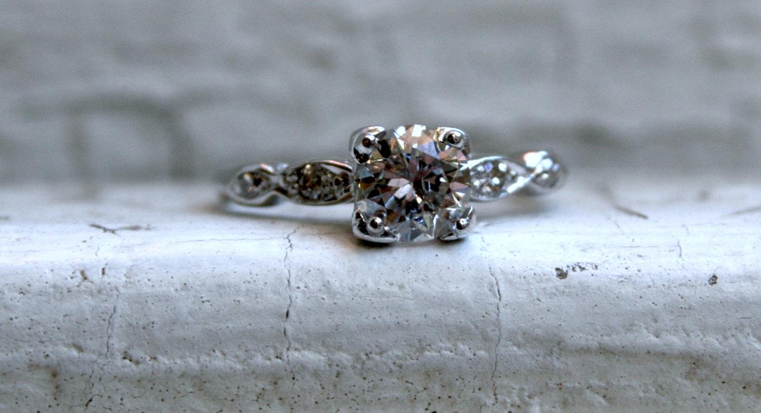 Sigh. I fell in love with this Fabulous Vintage Diamond Engagement Ring, and it is gorgeous! It's super sparkle and classic lines had me at first glance. Crafted in Platinum, the design features a stunning center Antique Diamond, with wonderful