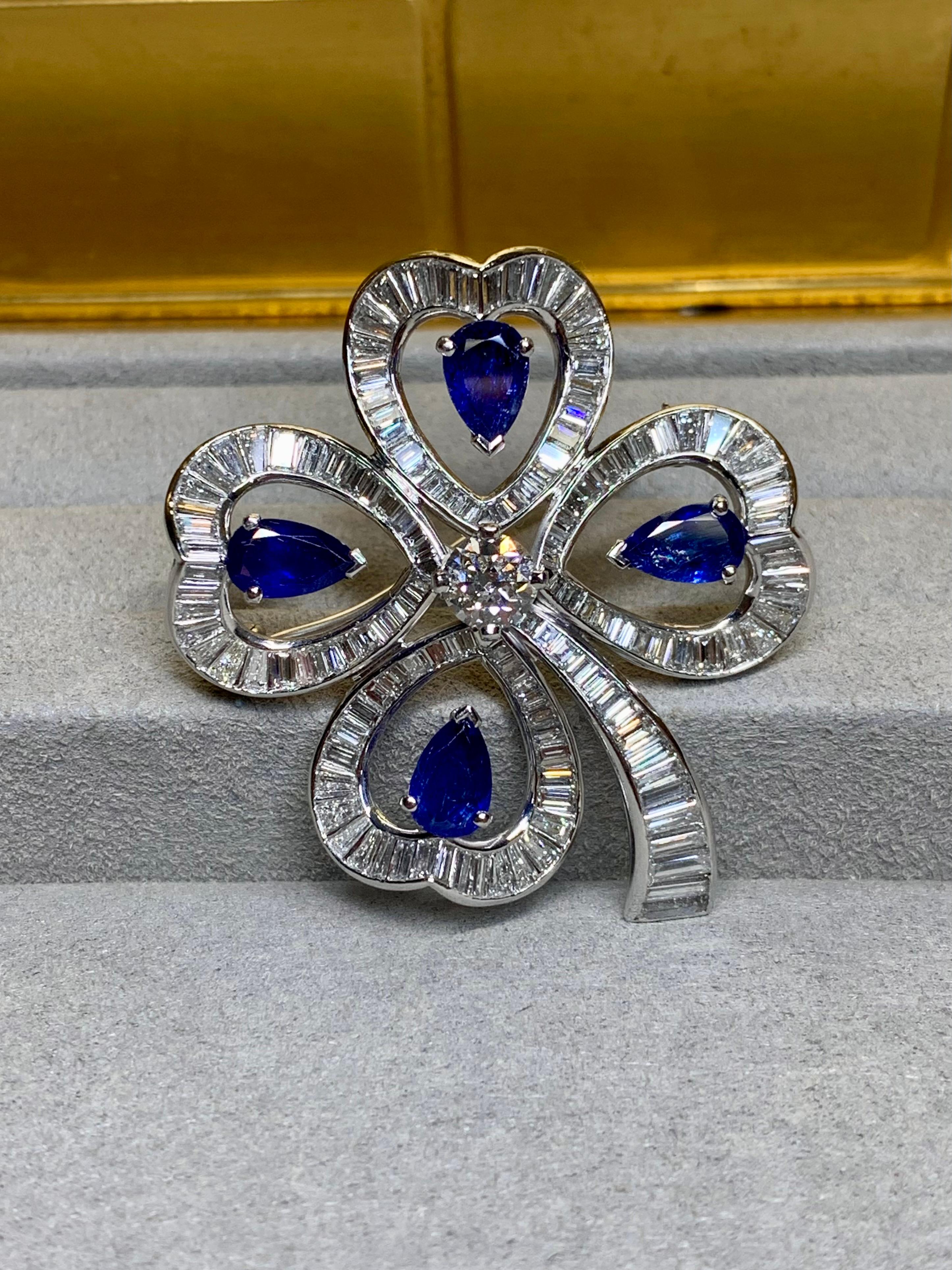 
A fabulous piece circa the early 1950s done in platinum and set with approximately 8.40ctw in G-H color Vs1-2 clarity baguette diamonds with the center stone being an old European cut round weighing approximately .80ct. The center stone is J color
