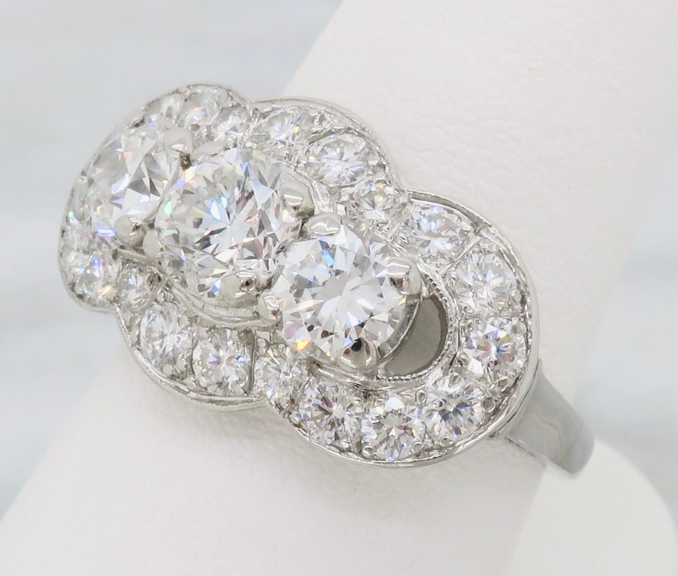 Incredible vintage diamond ring made in Platinum with 2.50ctw of diamonds. 

Diamond Cut: Round Brilliant Cut
Total Diamond Carat Weight: Approximately 2.50CTW
Center Diamond: Approximately .68CT
Center Diamond Color: H-I
Center Diamond Clarity: