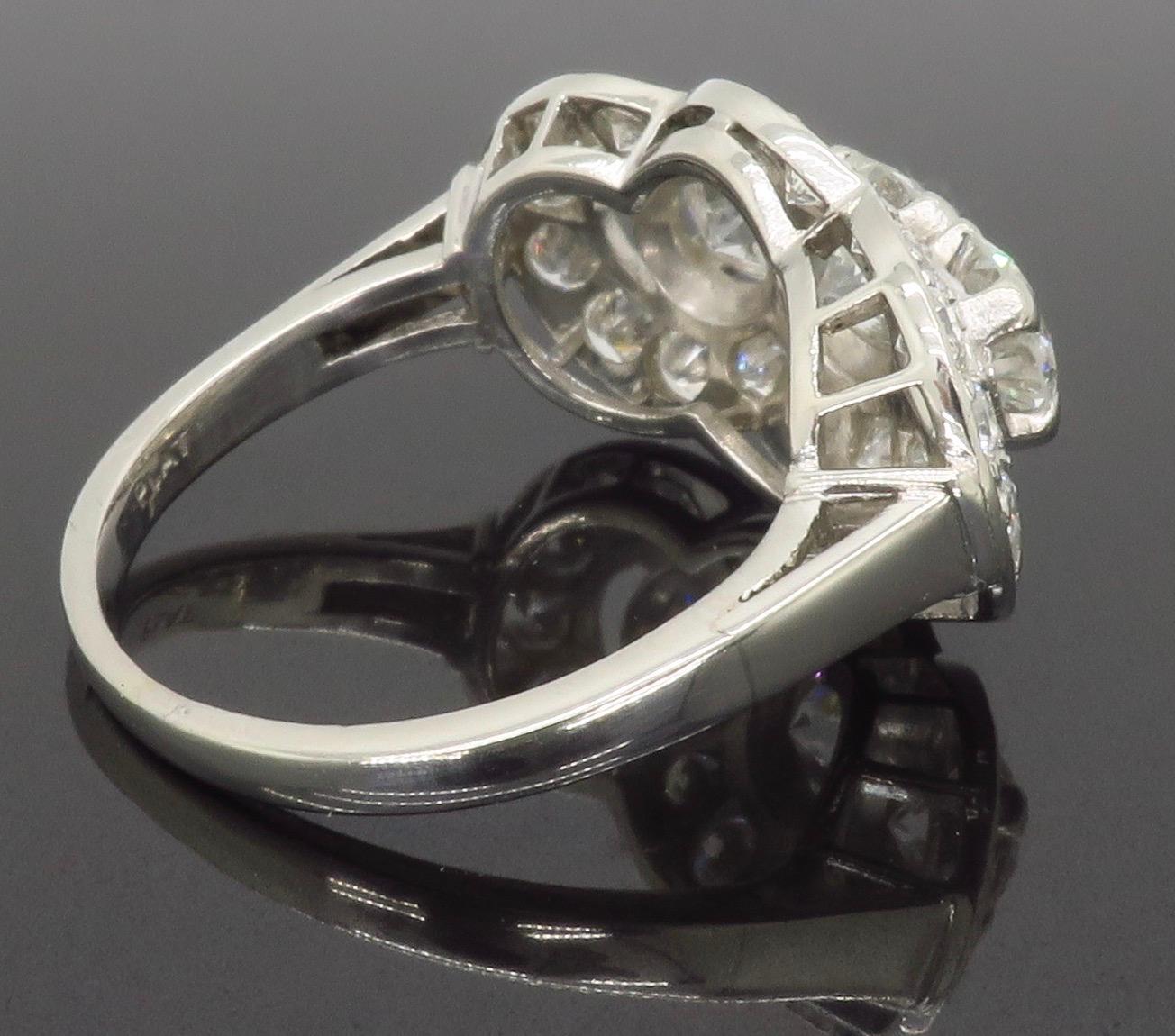 Vintage Platinum Diamond Three-Stone Halo Ring In Good Condition In Webster, NY