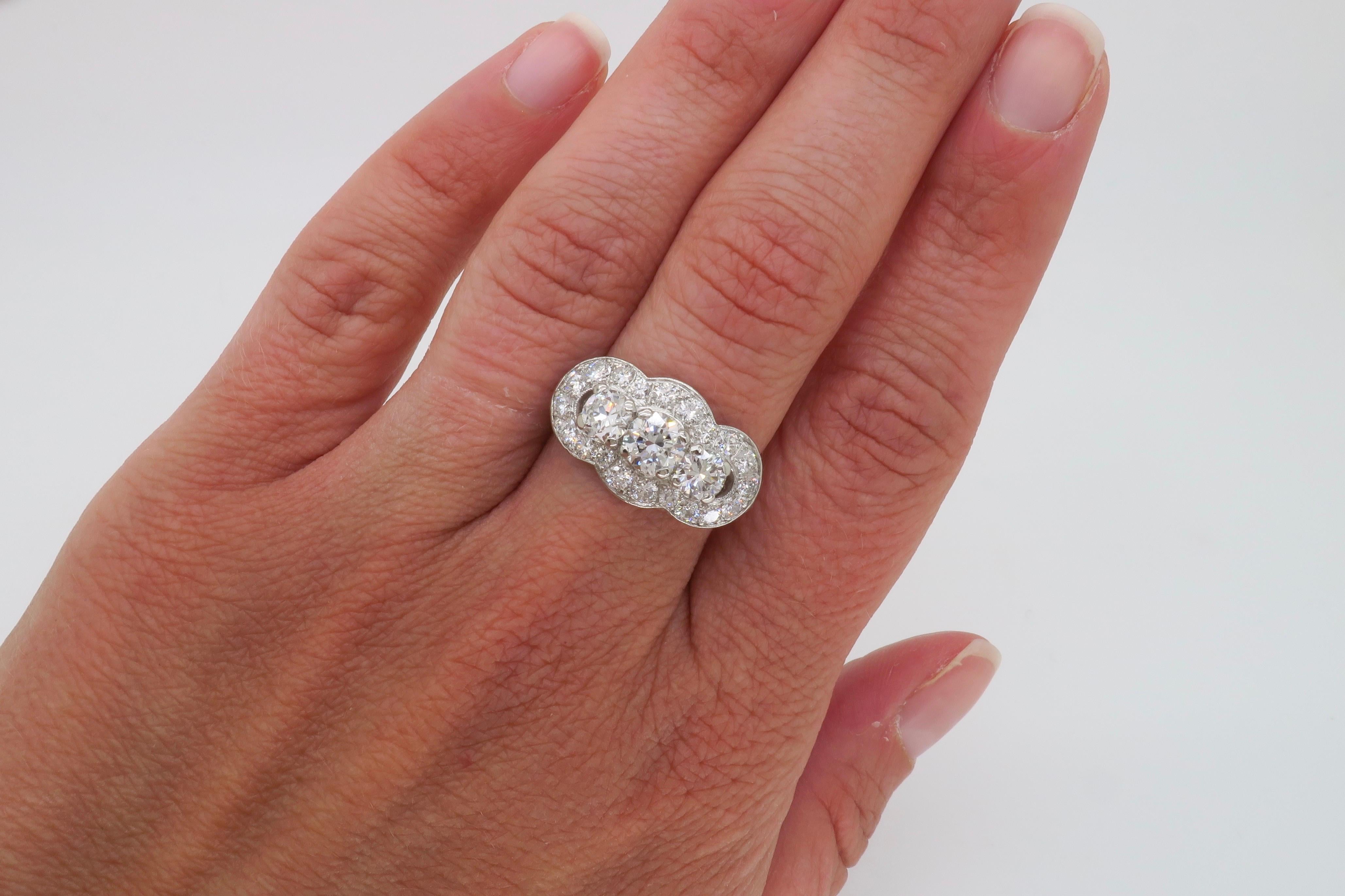 Vintage Platinum Diamond Three-Stone Halo Ring 1