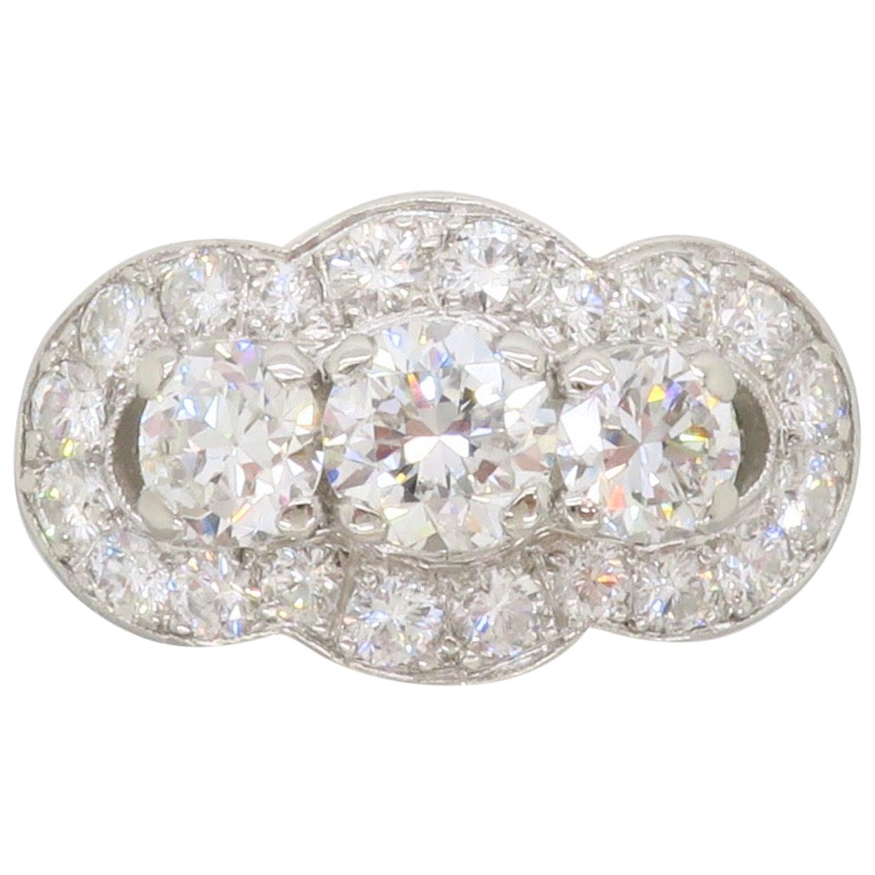 Vintage Platinum Diamond Three-Stone Halo Ring