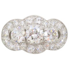 Vintage Platinum Diamond Three-Stone Halo Ring