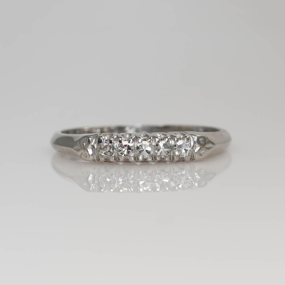 Ladies' vintage platinum and diamond wedding ring set.
Stamped plat. and weighs 7.8 grams. 
The center diamond is a round transition cut, approximately .70 carats, G, H color, Vs clarity.
The wedding band has five, single-cut diamonds, H, I, j