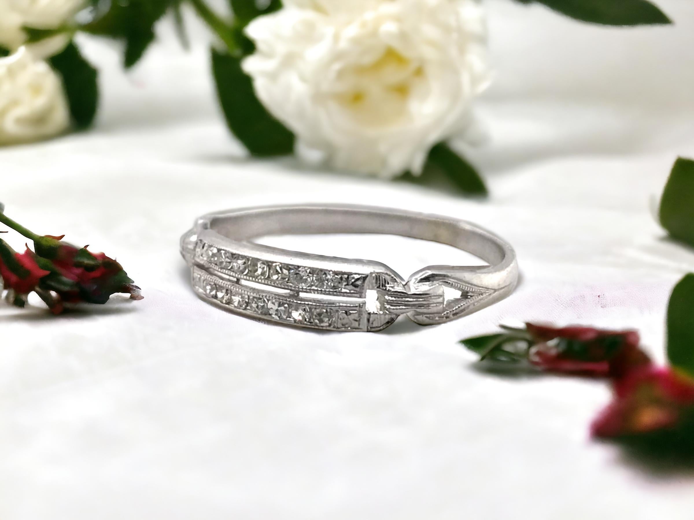 We are loving this dainty double row channel set band!
She is absolutely perfect to stack next to any vintage ring.

Ring Details
Material: Platinum
Era: Art Deco 1910 - 1930
Weight: 1.4 Grams
Width: 3.6mm
Height:1.45mm
Finger Size: 7
Sizable Upon
