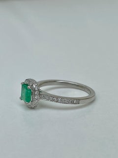 Vintage Platinum Emerald and Diamond Halo Ring