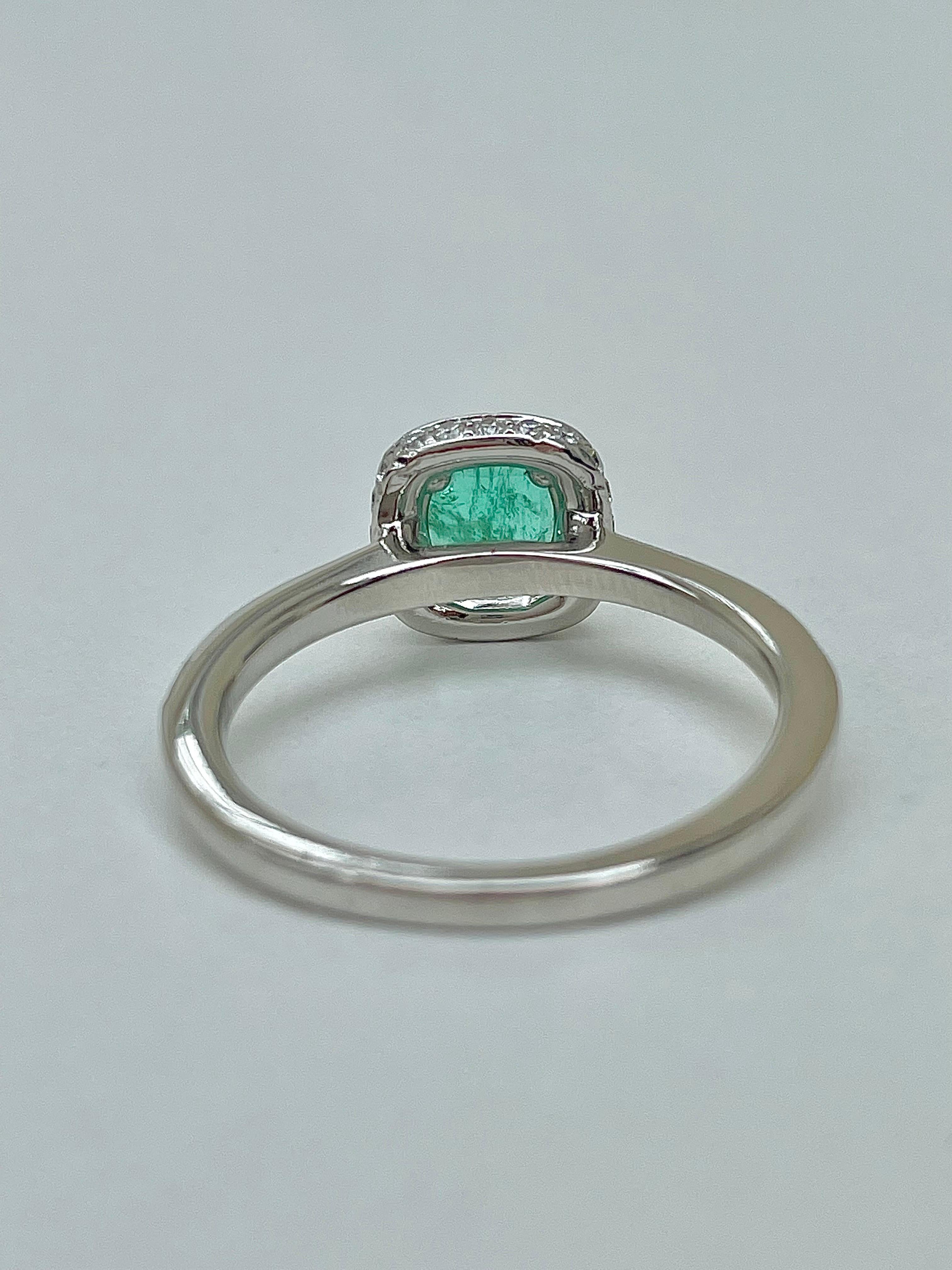 Emerald Cut Vintage Platinum Emerald and Diamond Halo Ring  For Sale