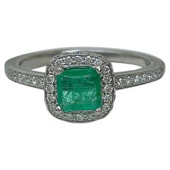 Vintage Platinum Emerald and Diamond Halo Ring