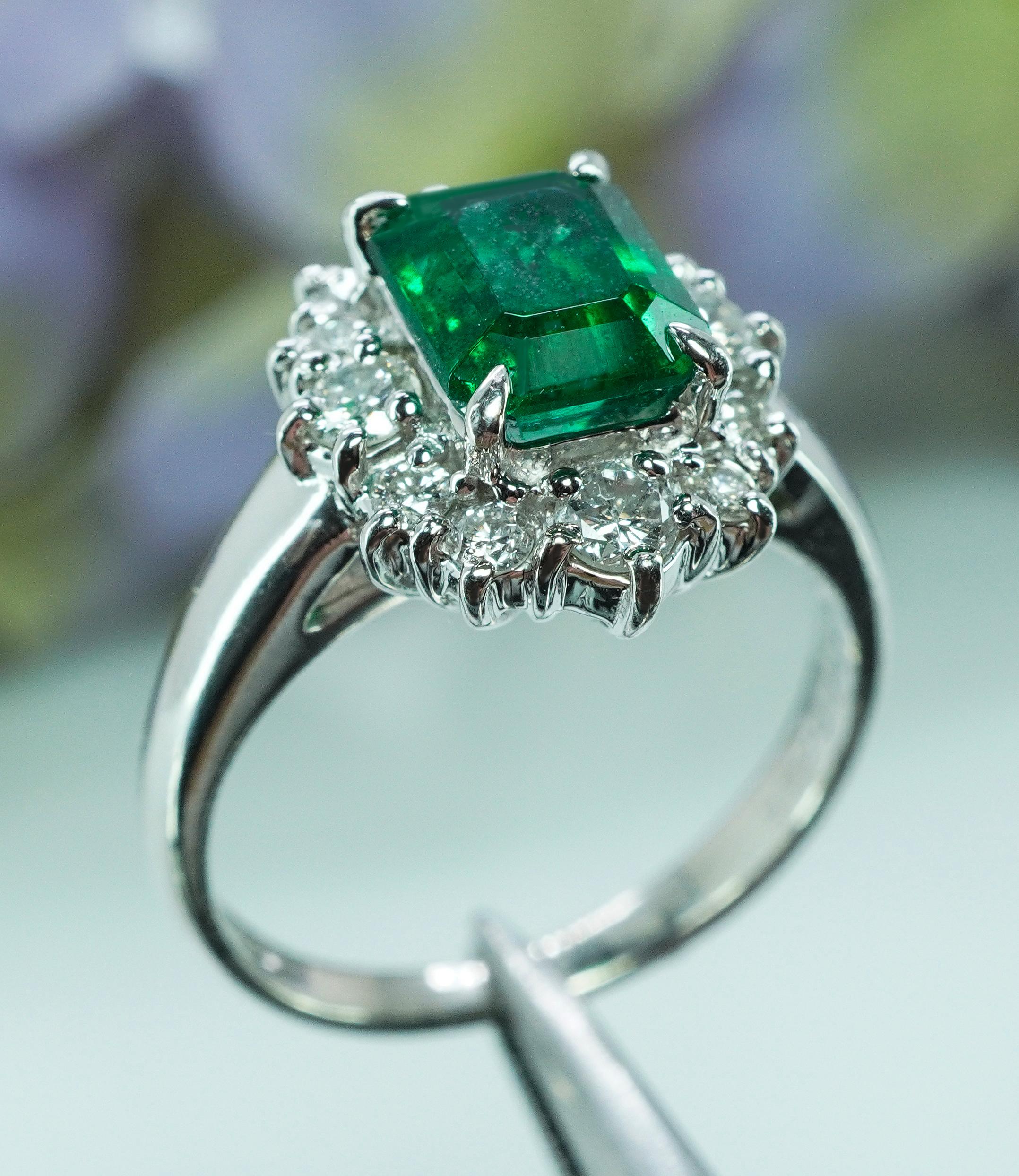  Vintage Platinum Emerald Diamond Halo Ring Designer Signed H Estate Jewelry

What a great ring. It has it all, a beautiful Emerald and brilliant diamonds set in a fascinating design. It is crafted in luxurious and expensive platinum (marked PT950).
