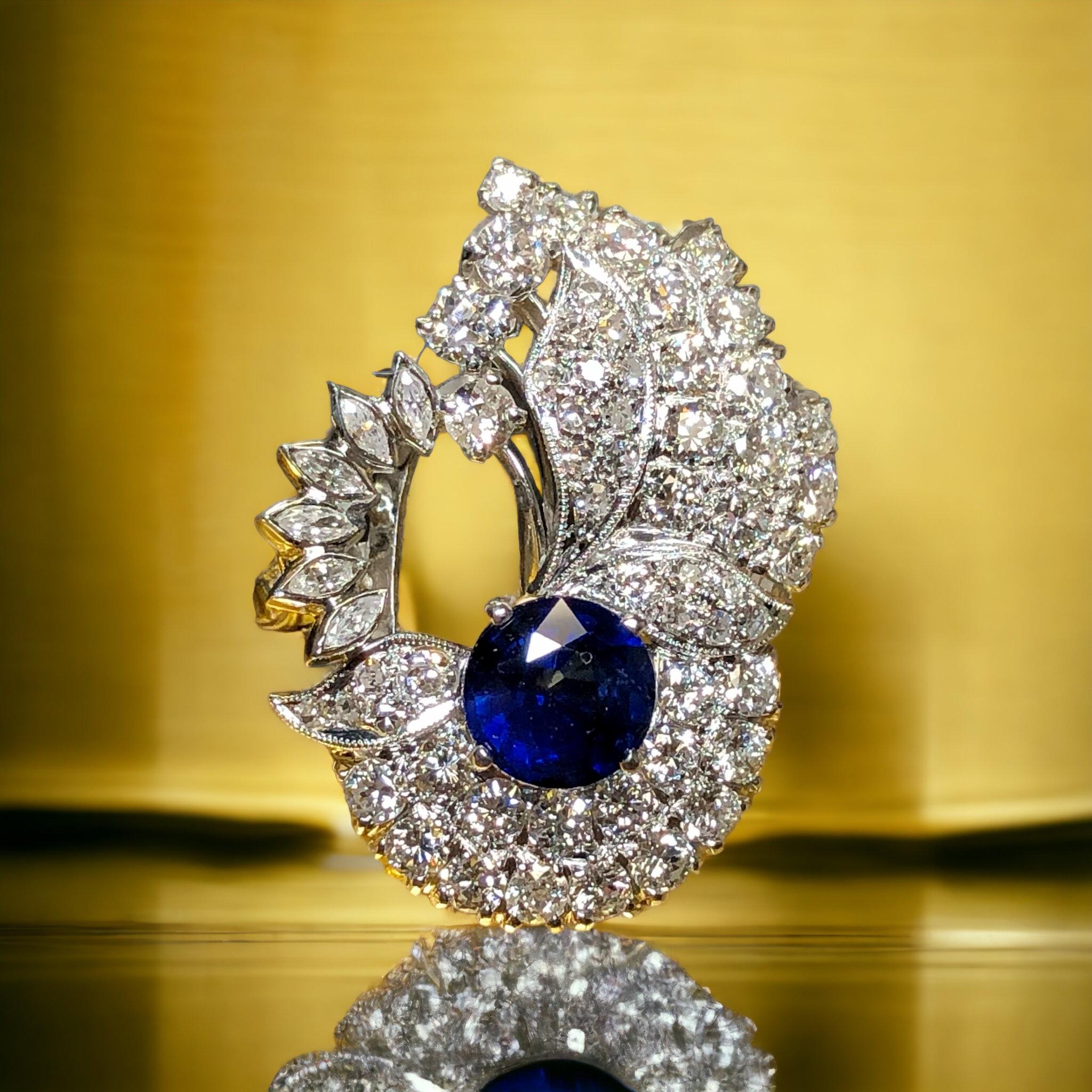 This ring is just gorgeous! Circa the 1940’s, It has been hand done in platinum and centered by a 1.54ct (known weight) natural sapphire surrounded by approximately 2.60cttw in G-H color Vs1-2 clarity old European, mine cut and marquise diamonds.