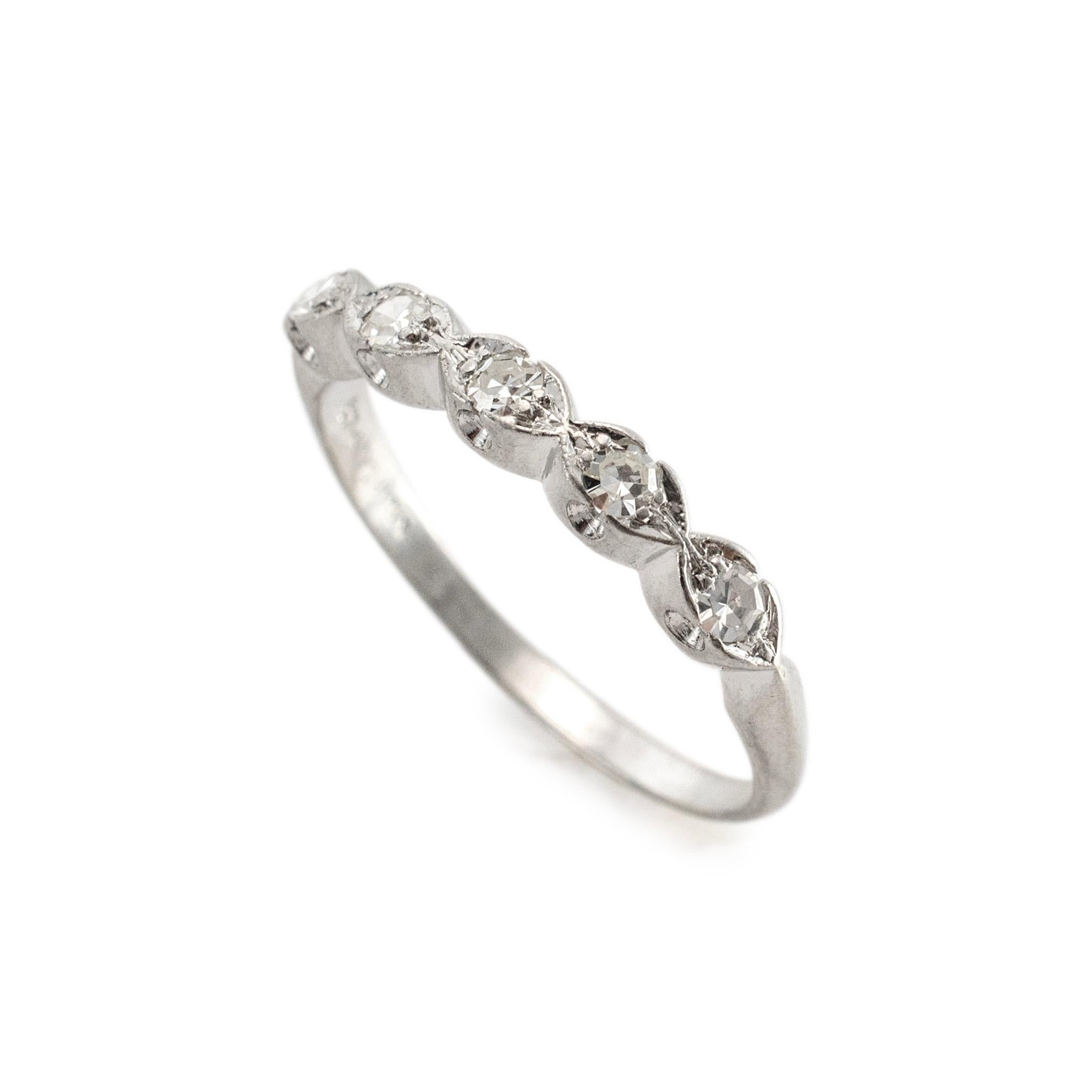 Gender: Ladies

Metal Type: Platinum 

Size: 8.25

Width: 2.80 mm

Weight: 3.00 Grams

One ladies custom made platinum five-across, diamond vintage wedding band with a half-round shank. The metal was tested and determined to be platinum. Engraved