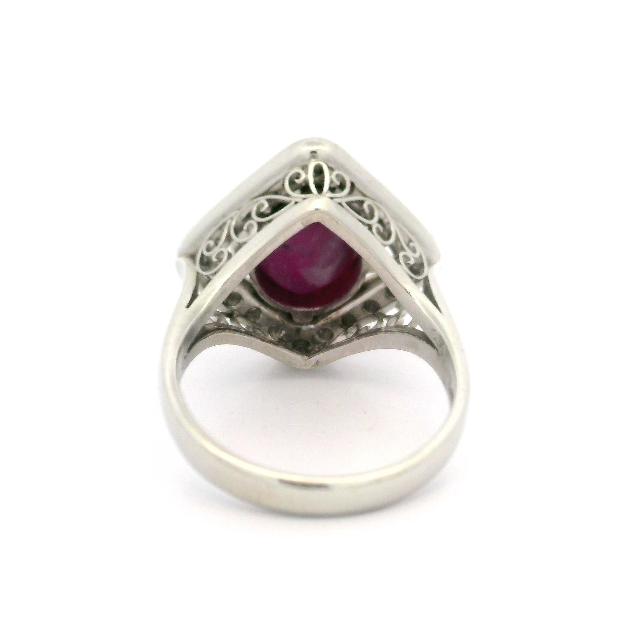 --Stone(s):--
(1) Natural Genuine Star Ruby - Oval Double Cabochon Cut - Claw Prong Set - Purplish-Red Color - Nice Star - 7.15ct (exact)
** See Certification Details Below for Complete Info **
(20) Natural Genuine Diamonds - Round Brilliant Cut -