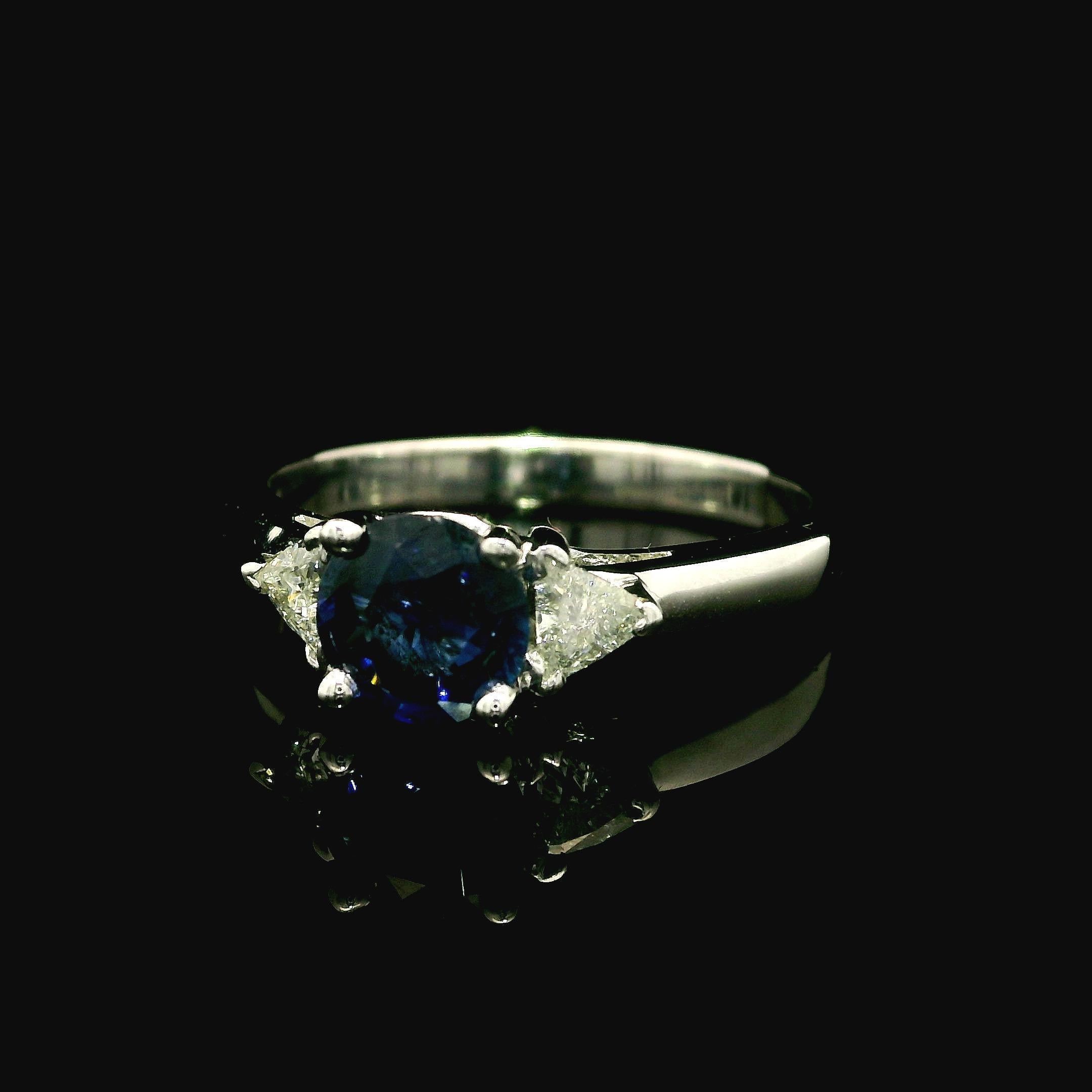 --Stone(s):--
(1) Natural Genuine Sapphire - Round Cut - Prong Set - Blue Color - Heated -1.10ct (exact - certified)
** See Certification Details Below for Complete Info **
(2) Natural Genuine Diamonds - Trillion Cut - Prong Set - Nice White Color -