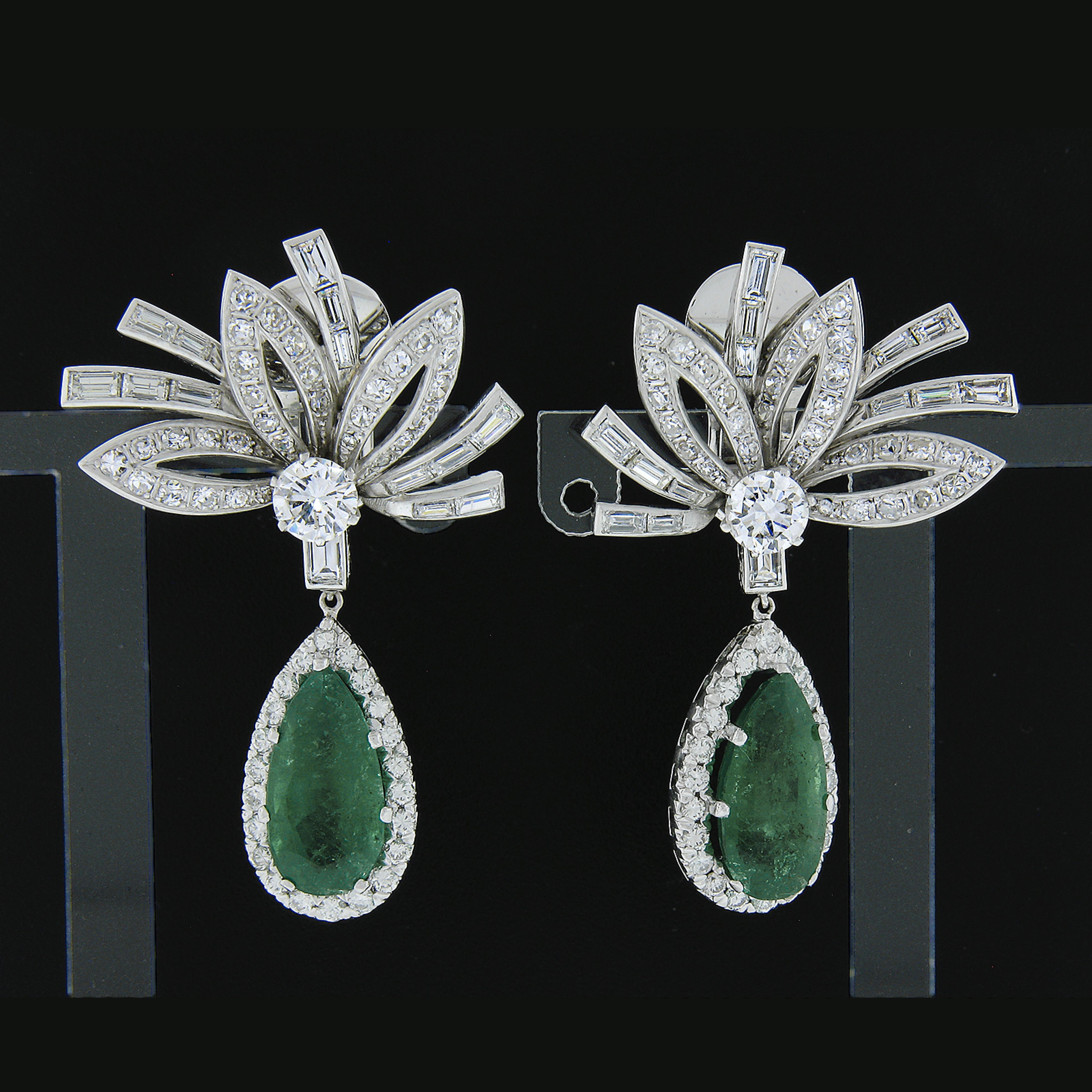 You are looking at a truly breathtaking pair of earrings that are crafted in solid platinum and feature two very well matched, GIA certified, pear brilliant cut emerald in which together total approximately 8.38 carats in weight. These fine stones
