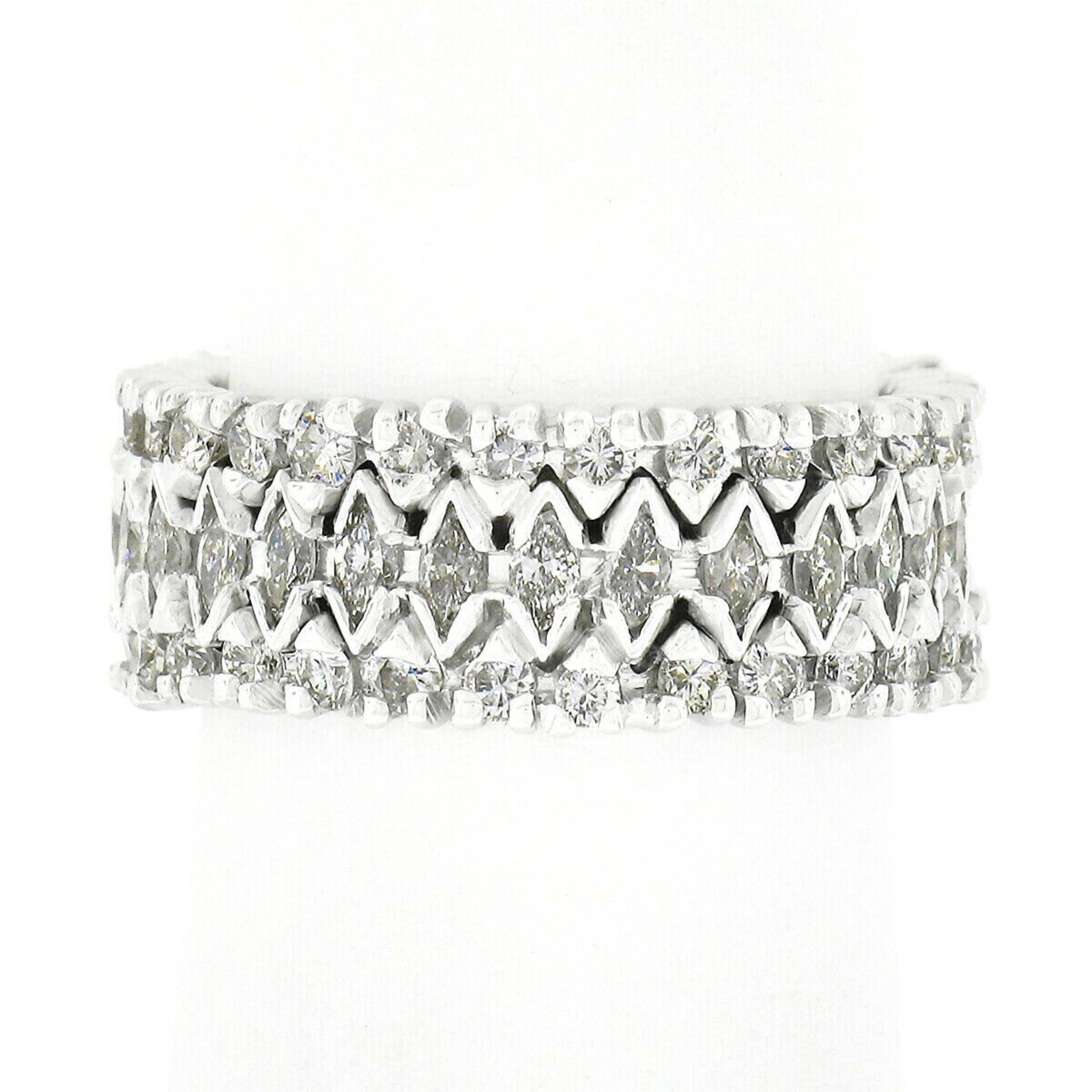 This absolutely breathtaking vintage eternity band ring is crafted in solid platinum and features approximately 3.45 carats of very fine quality diamonds elegantly drenched entirely around the band. Its unique, wide, 3-row design features marquise