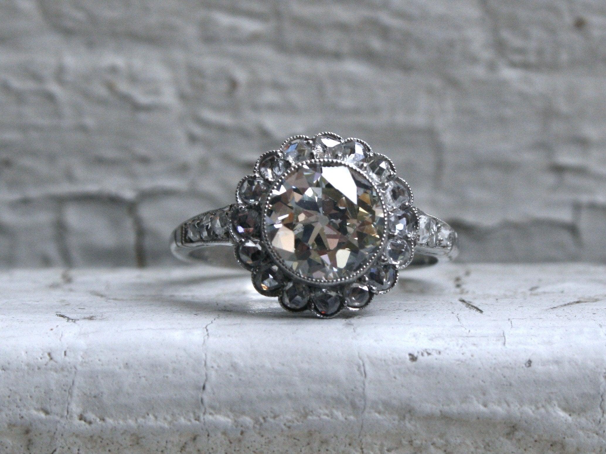 So gorgeous! I can't even explain how much I LOVE this Vintage Halo Diamond Engagement Ring. It has super sparkle, and is like, totally perfect! Crafted in Platinum, the design features a wonderful large Old Mine Cut Diamond Center Stone, surrounded