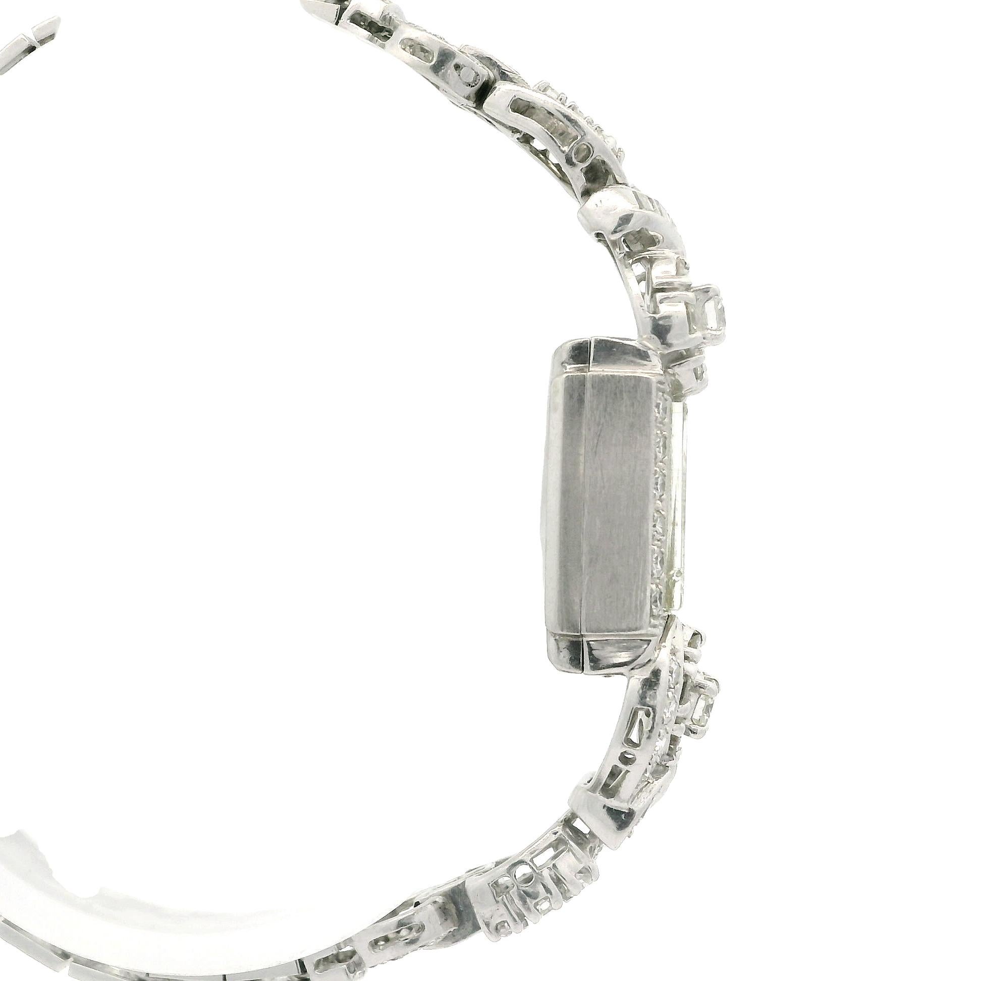MATERIAL:	Gehäuse & Armband: Platin - Sicherheitskette: Weißgold 
Gehäuse Gesamthöhe:	38mm (1.3