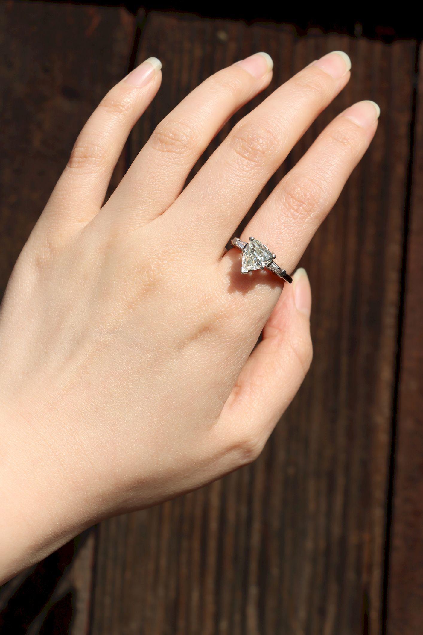 Vintage Platinum Heart Shape Diamond Ring

Marked:
HANDMADE 
10% IRID
PLAT

Approximate Dimensions:
6.75 (Ring Size)
2.14 carats (Diamond)
H-Color (Diamond)
5.6 grams in weights.

** All dimensions listed above are approximations based on our