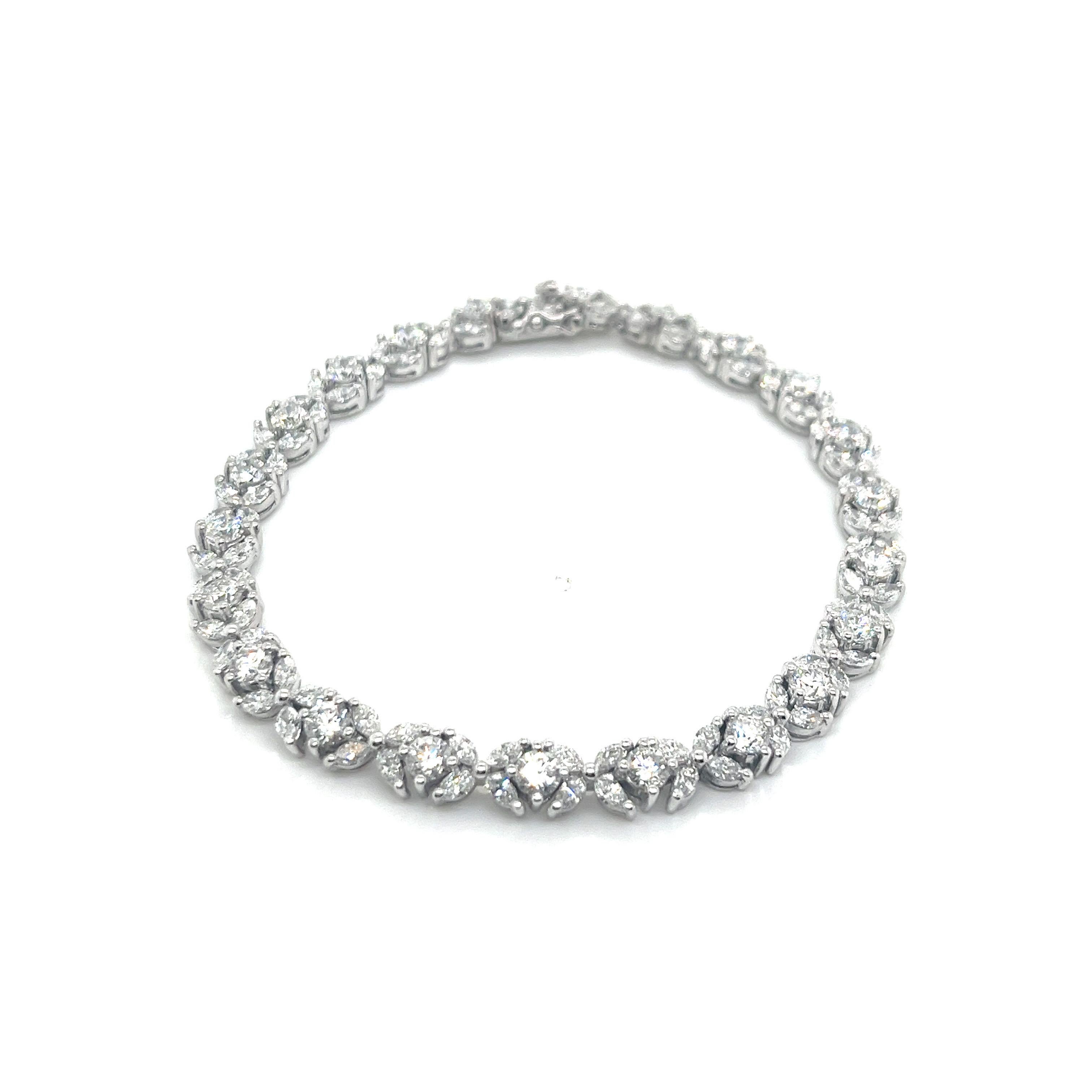 This exquisite vintage bracelet is a true masterpiece of platinum and diamond artistry. Featuring an elegant alternating design of marquise and round brilliant diamonds, it exudes timeless sophistication and glamour.

The bracelet is comprised of 22
