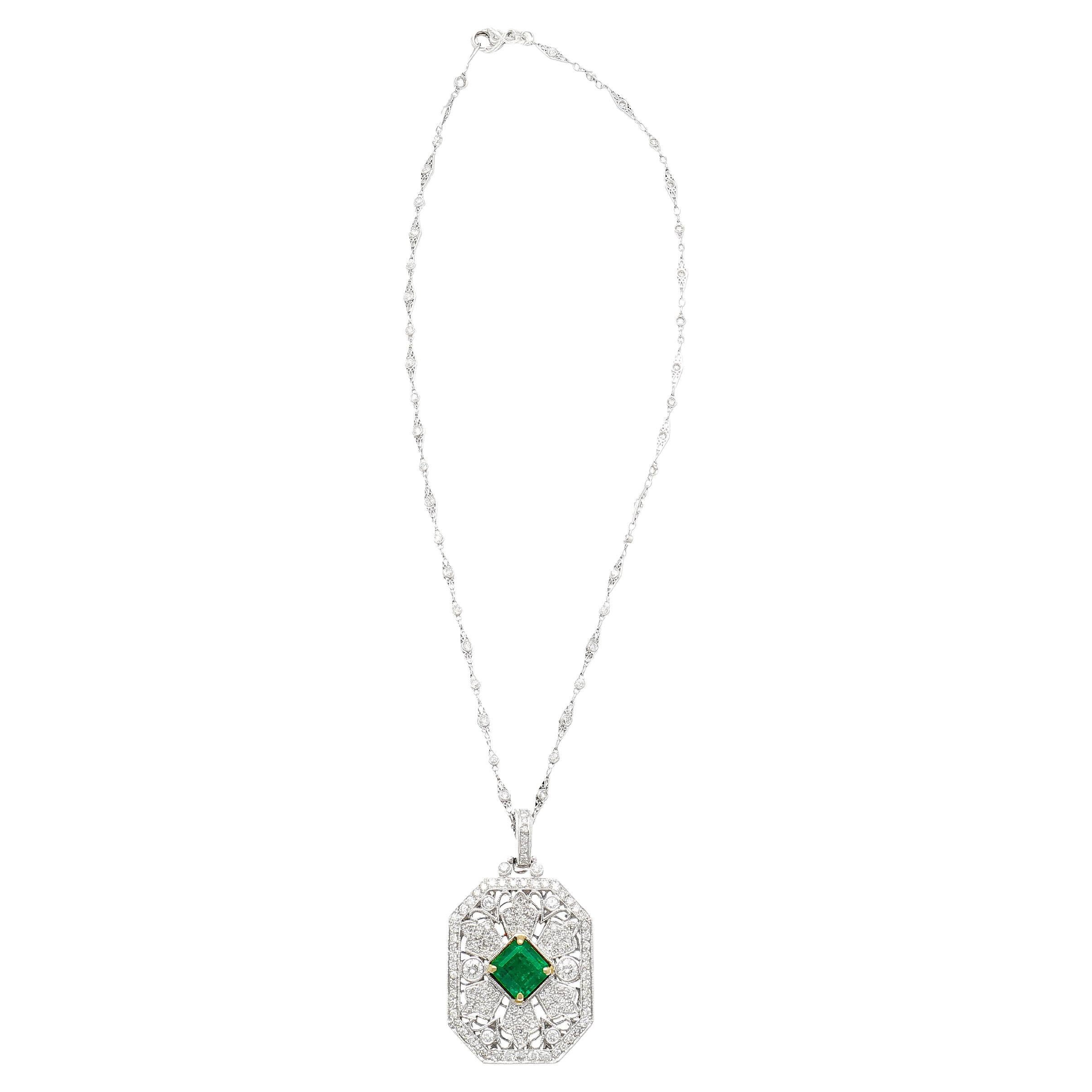 Upgrade to luxury with this enchanting pendant necklace. Expertly crafted, this piece showcases a breathtaking GRS certified vivid green emerald with minor oil treatment. Intricately carved Art Deco style with a catching design. All set in reliable