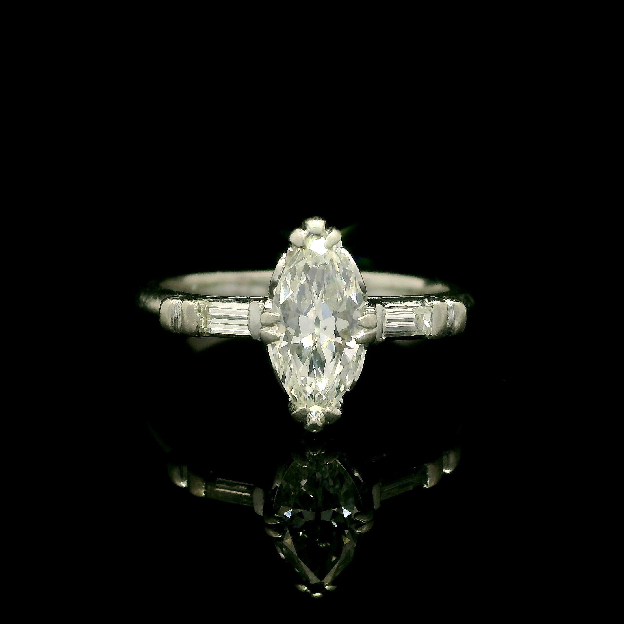 --Stone(s):--
(1) Natural Genuine Diamond - Old Marquise Cut - Prong Set - G Color - SI1 Clarity - 0.76ct (approx.)
(2) Natural Genuine Diamonds - Baguette Cut - Channel Set - G/H Color - VS2/SI1 Clarity - 0.12ctw (approx.)
Total Carat Weight: 0.88