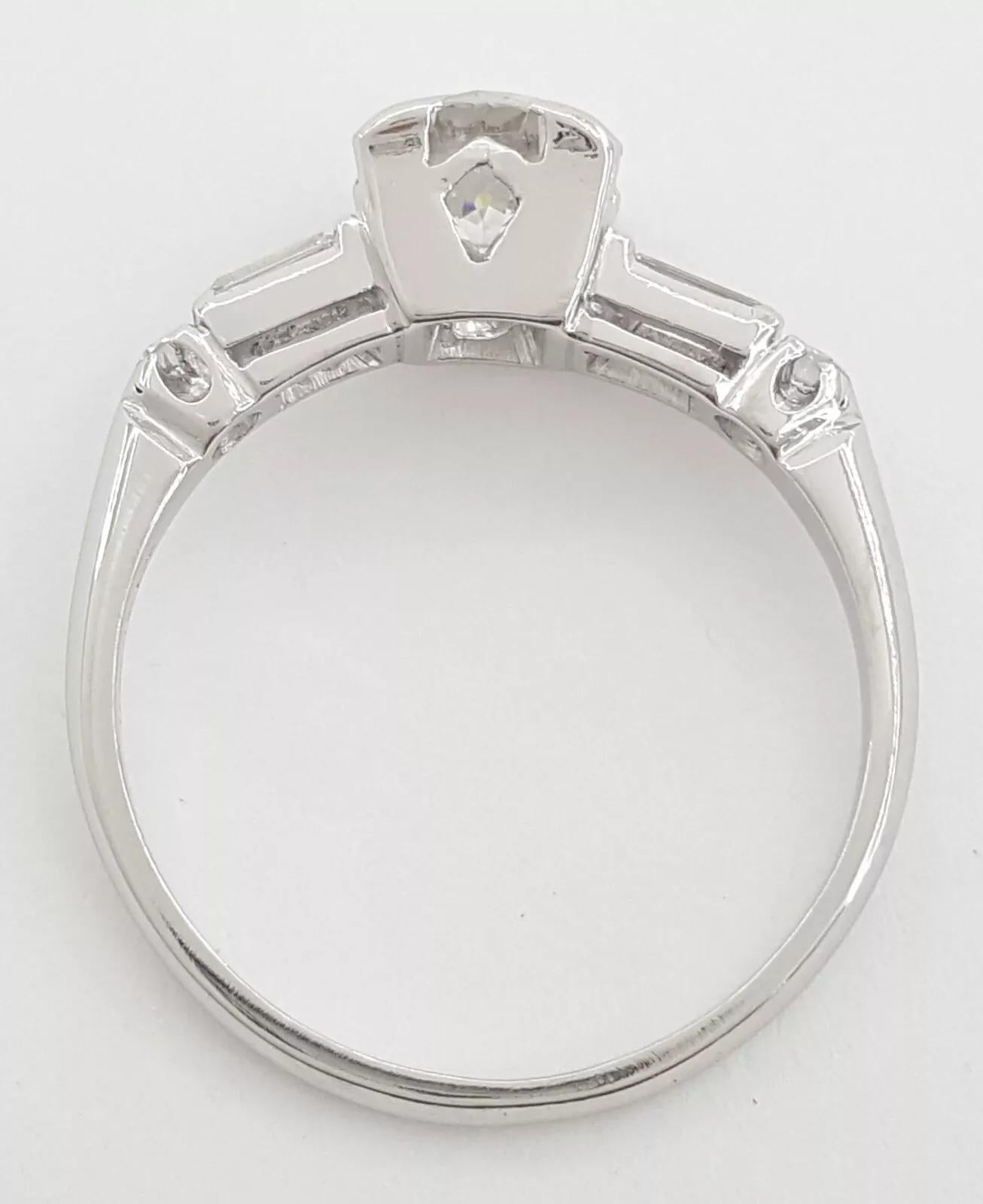 Vintage Platinum Old European Cut Diamond Three 3-Stone Anniversary / Engagement Ring.



The ring weighs 4 grams, size 7, the center stone is a Natural Old European Cut diamond weighing approximately 0.72 ct, G-H in color, VS in clarity.



There