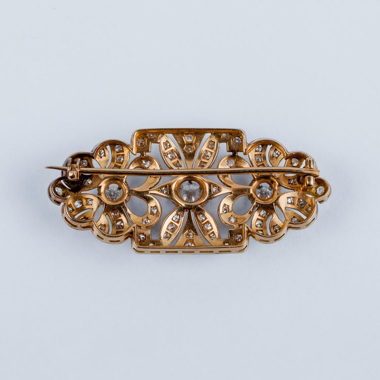 Vintage pin brooch in rose gold setting with three central diamonds in claws and openwork design full of diamonds and knurled platinum.

MATERIAL
◘ Weight 11.1 grams 
◘ Size 23x47mm  / 0.90x1.85 inches 
◘ Central Diamonds aprox 0.40ct 
◘ Diamonds 65