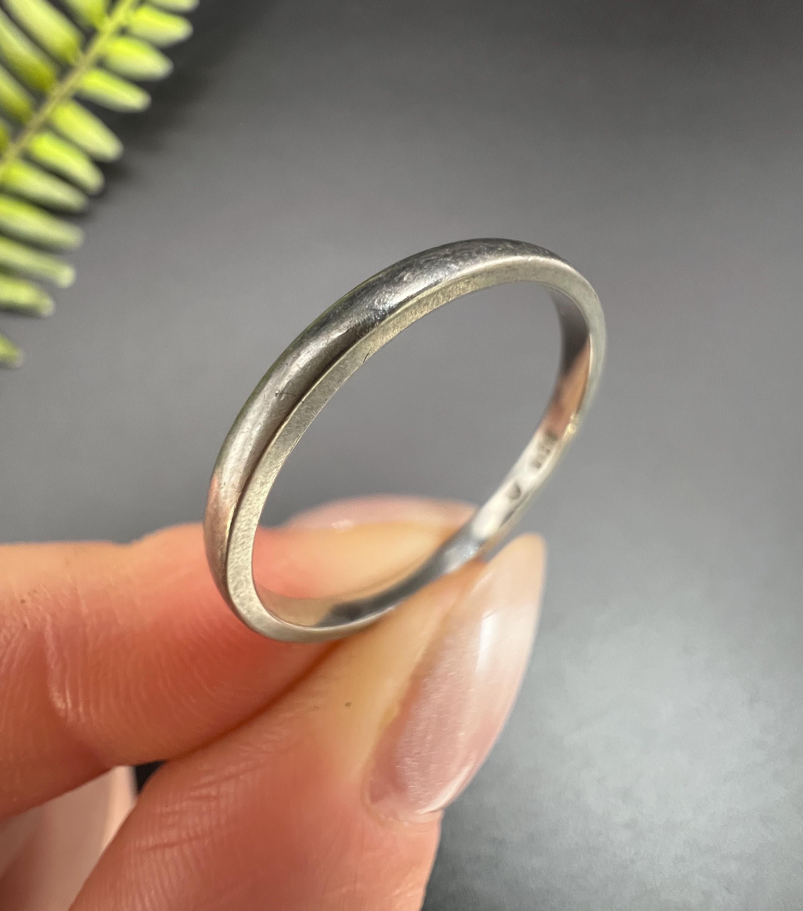 Vintage Wedding Band

Platinum

Makers  G C 

Hallmarked London 1992

This exquisite platinum wedding band, hallmarked in London in 1992, embodies timeless sophistication. With a sleek and understated design, the band measures 2mm in thickness,