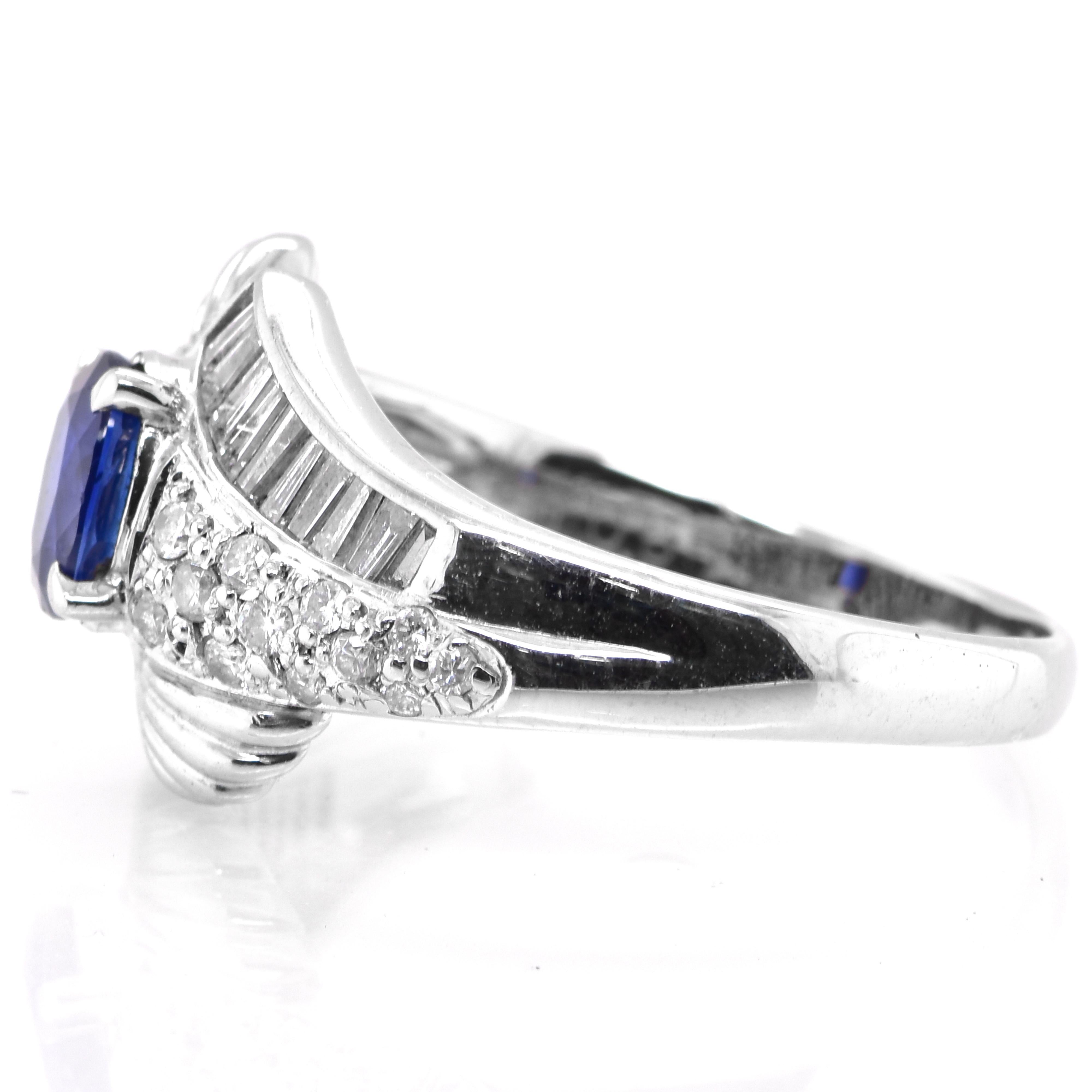 Oval Cut Vintage Platinum Ring featuring a 1.05 Carat Blue Sapphire and Diamonds For Sale