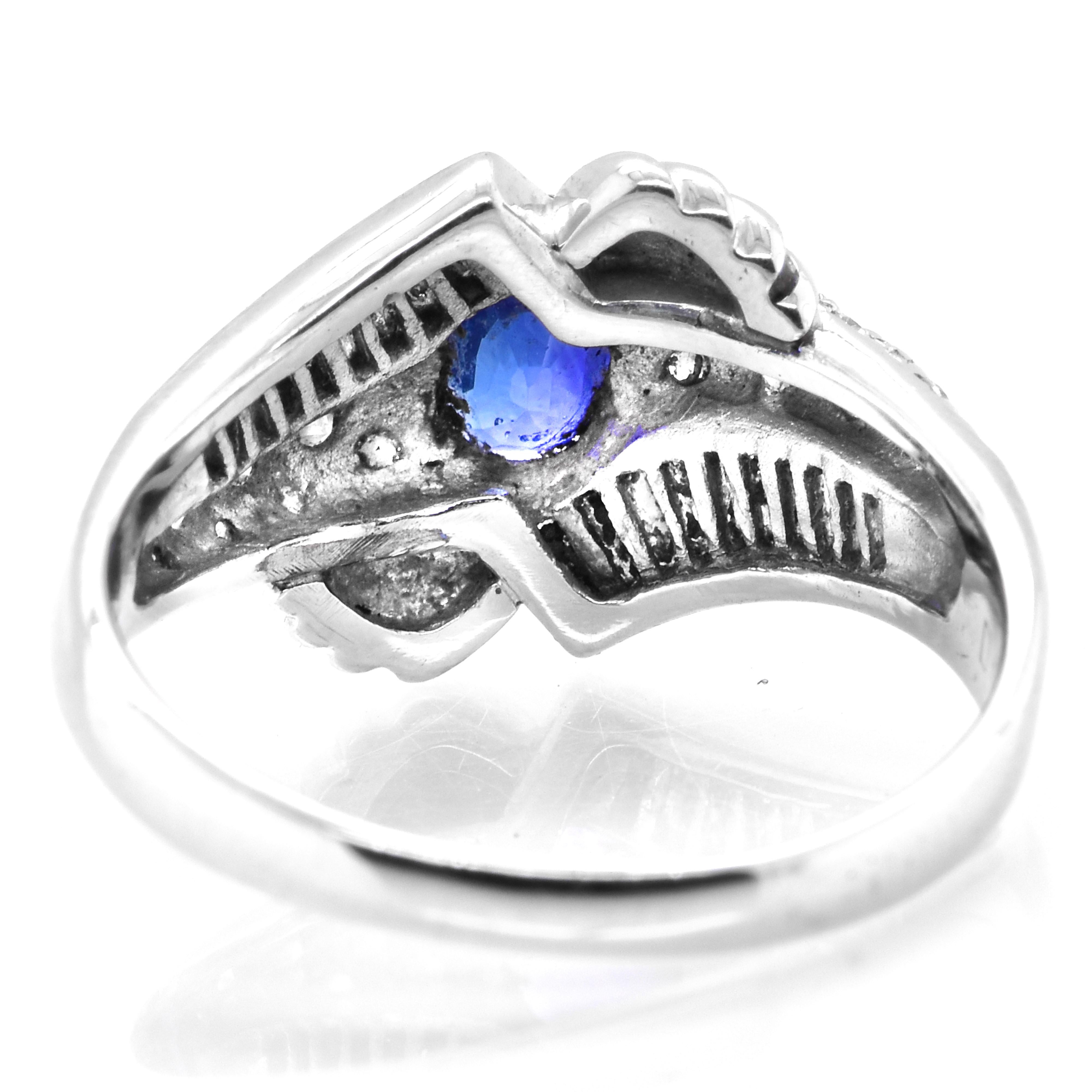 Women's Vintage Platinum Ring featuring a 1.05 Carat Blue Sapphire and Diamonds For Sale