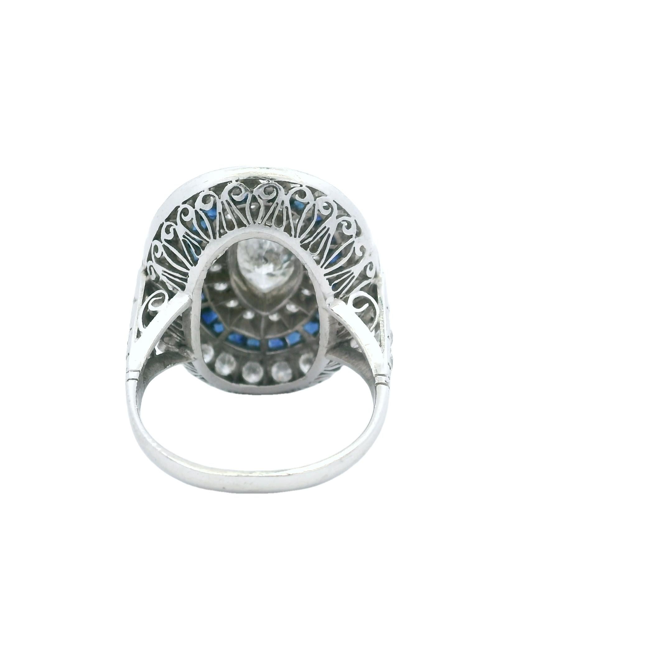 Vintage Platinum Ring with Marquise Diamond & Sapphire Halo, circa 1920s In Excellent Condition For Sale In Miami, FL