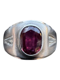 Vintage Platinum Ring with Oval Ruby and Tapered Baguette Diamonds