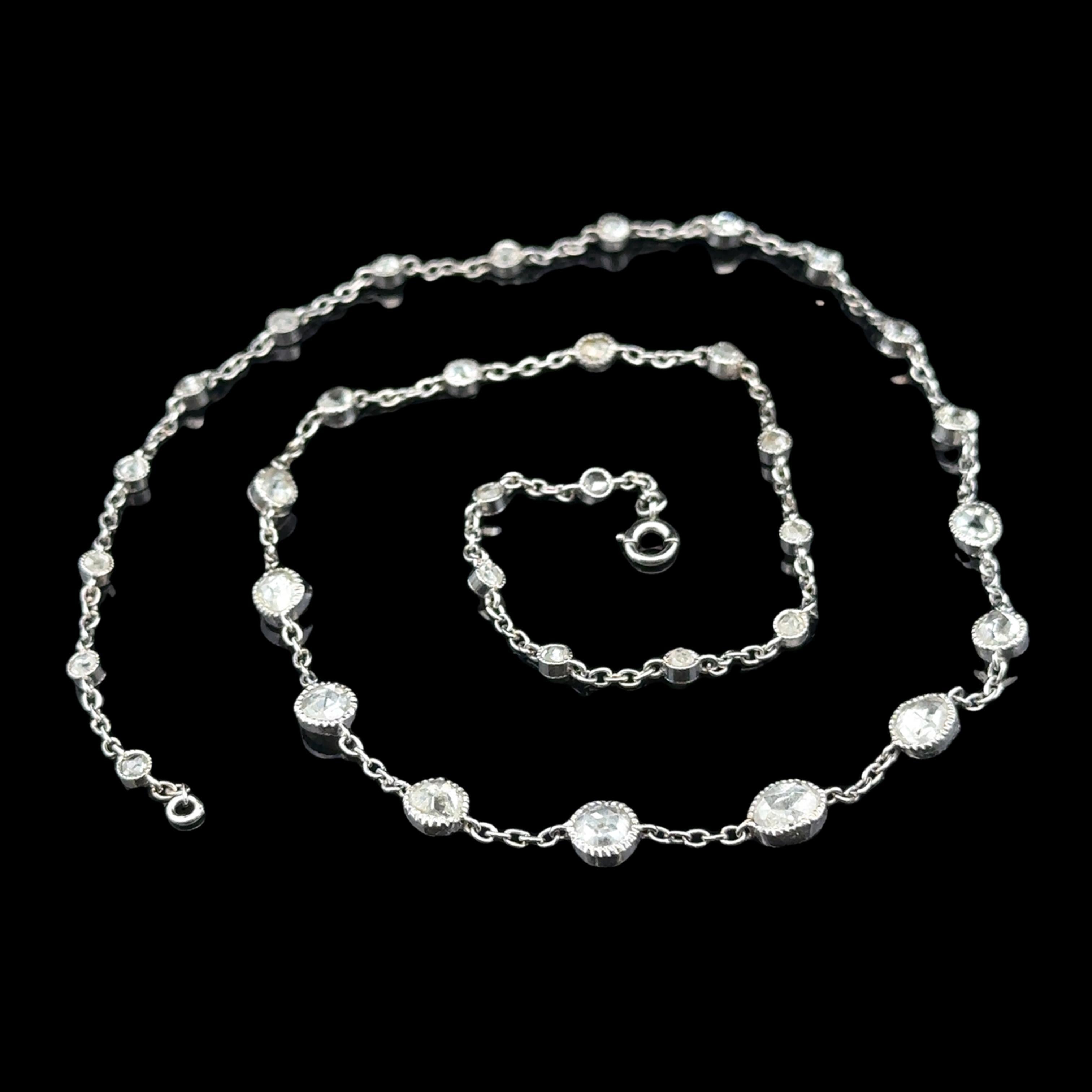 --Stone(s):--
(68) Natural Genuine Diamonds - Rose Cut - Bezel Set

Material: Solid Platinum 
Weight: 7.78 Grams
Chain Type: Diamond Station Cable Link
Chain Length: 16 Inches
Clasp: Spring Ring
Width: Graduated from 2.6mm to 5.2mm (at the