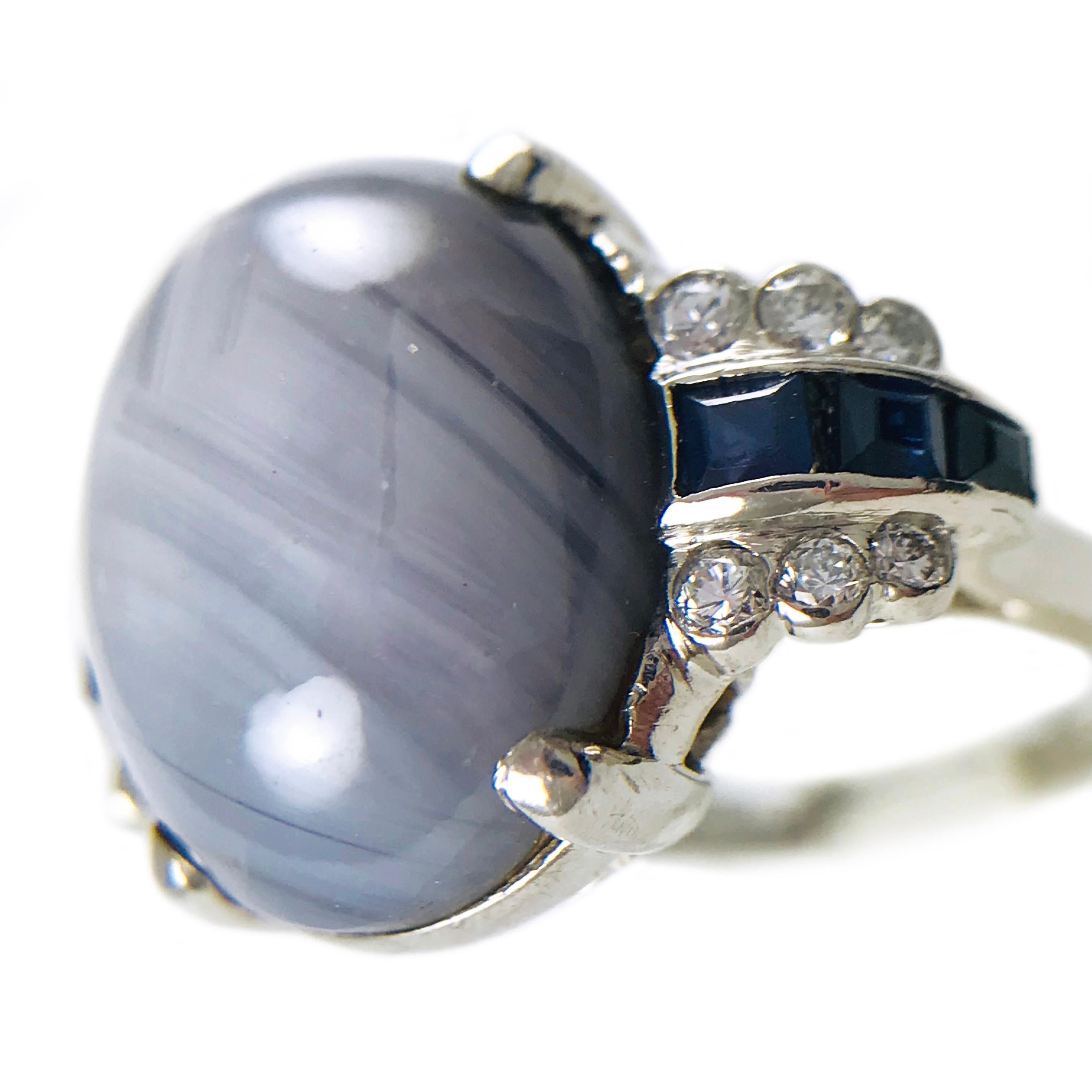 Vintage Platinum Star Sapphire Diamond Ring. Natural Star Sapphire Cabochon is 14.0mm x 12.5mm x 10.0mm, four prong set. The star has an excellent presence with light (see last photo). Ornate basket, airline and shoulders in true Art Deco style.