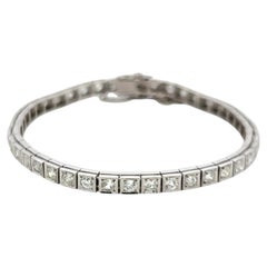 Vintage Platinum Tennis Bracelet with 4.49ct Baguette & Old European Cut Diamond