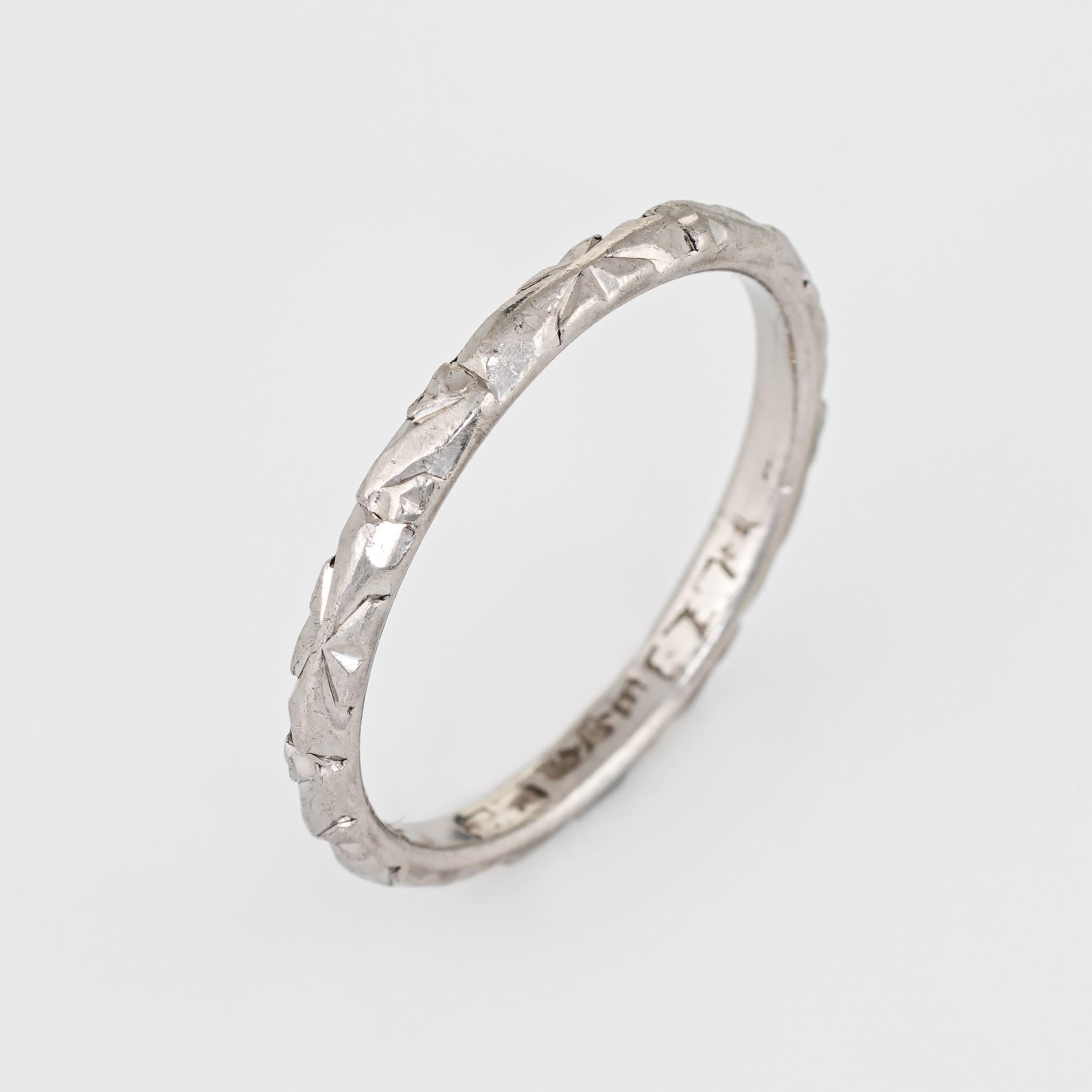 Finely detailed vintage wedding band (circa 1959), crafted in 900 platinum. 

The ring epitomizes vintage charm and would make a lovely alternative wedding ring. The outer band features a floral pattern in very good condition showing minimal wear.