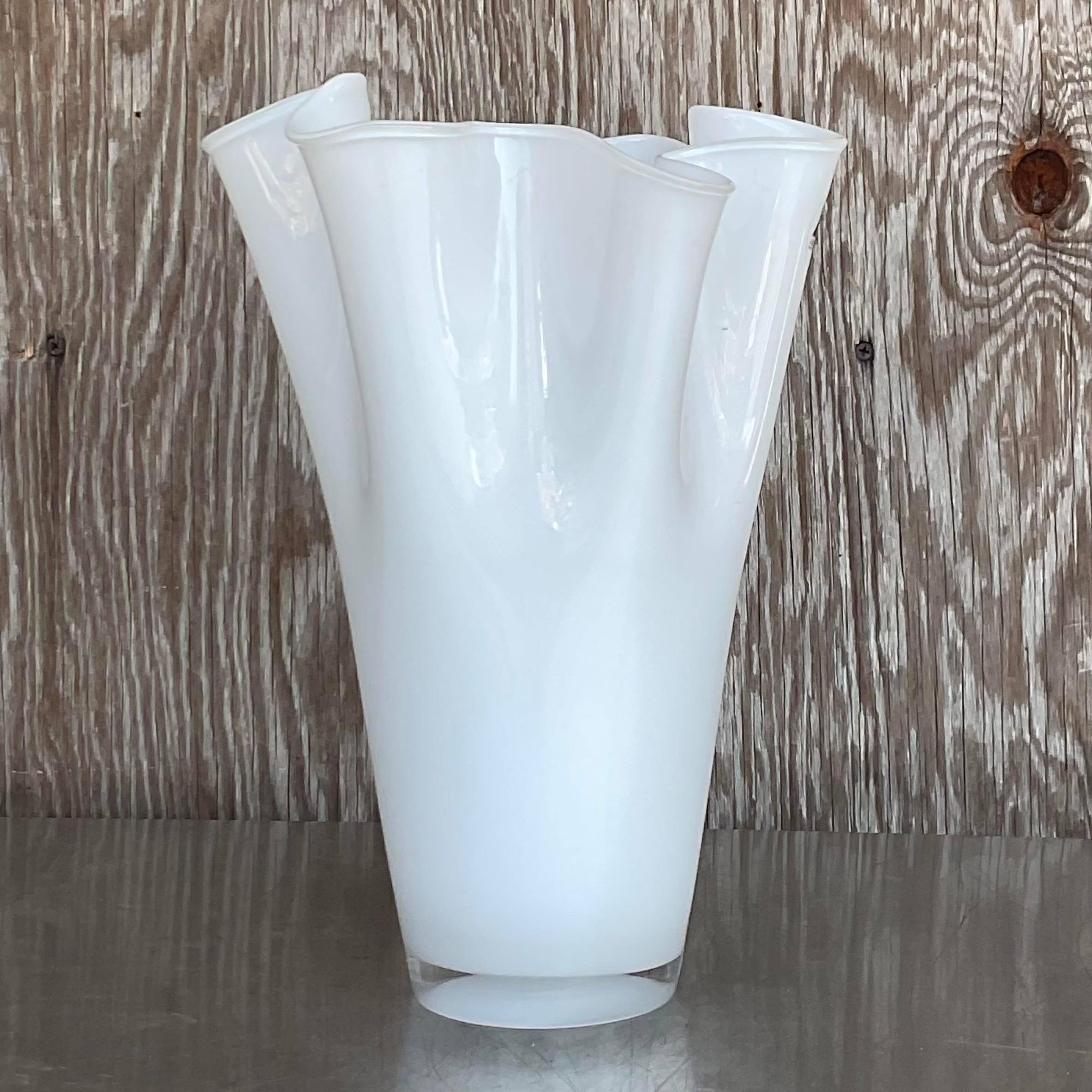 A stunning vintage white pleated vase. A very chic way to display your freshly cut flowers. Acquired at a Palm Beach estate