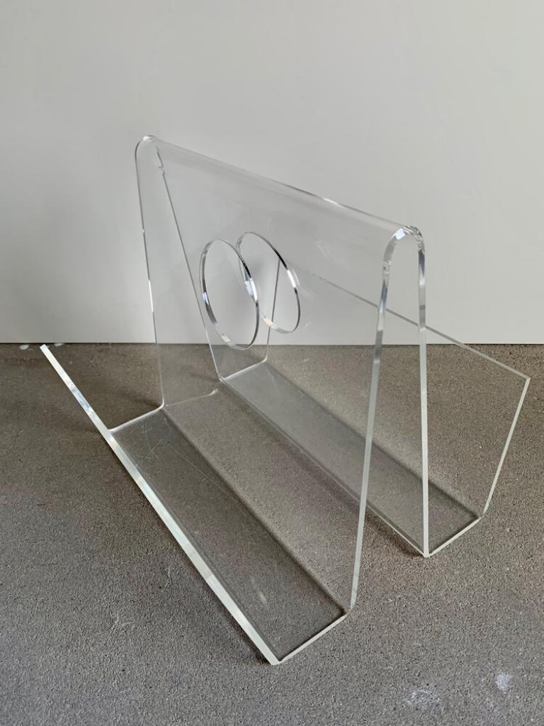 Vintage transparent plexiglass magazine rack from the 1970s.

Additional information:
Country of manufacture: 
Period: 1970s
Dimensions: 33 W x 29.5 D x 29.5 H cm
Condition: Good vintage condition, some signs of use - scratches