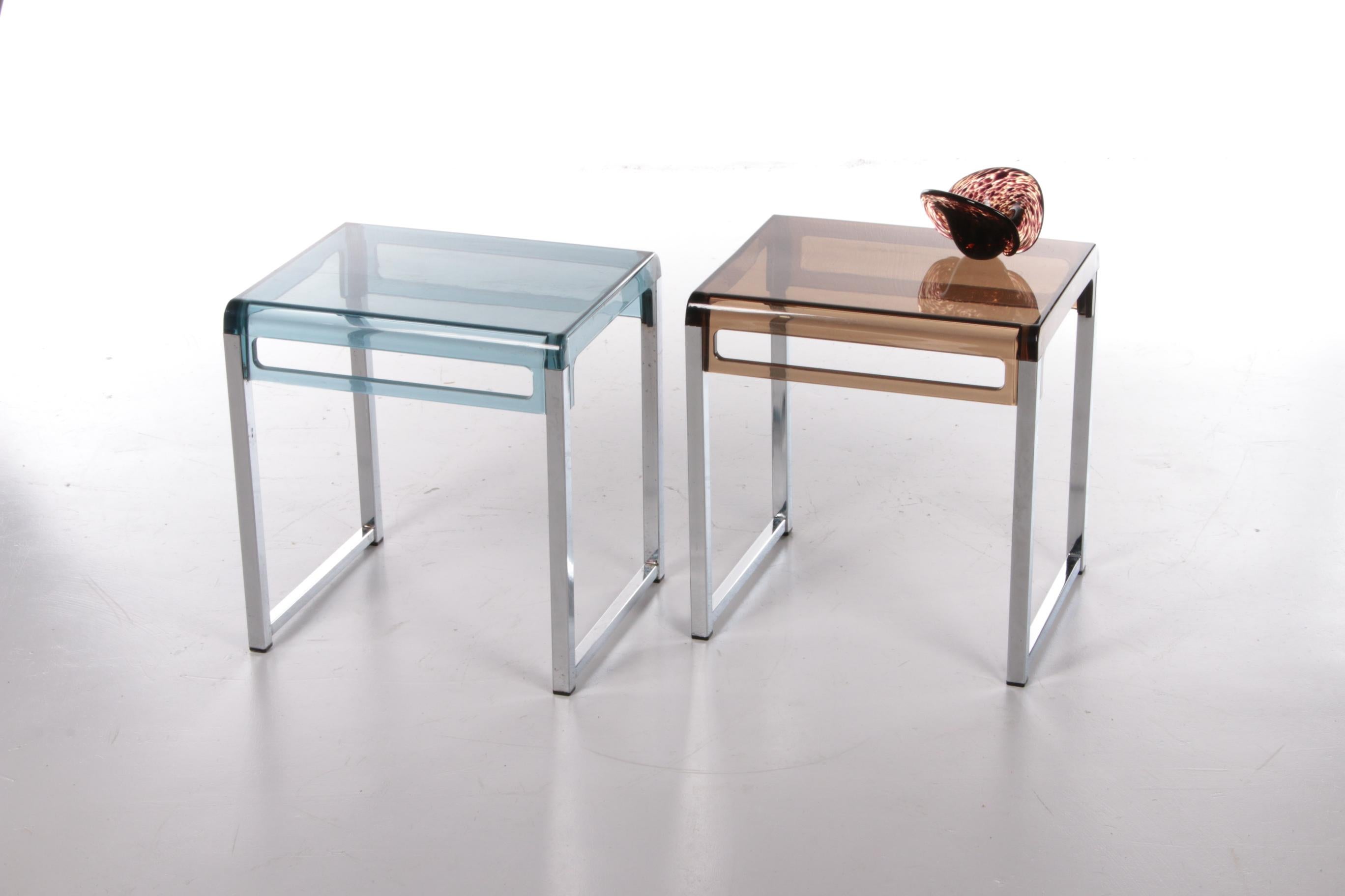 Vintage Plexiglass Side Tables Marc Berthier - Set of 2, 1960s

Discover the charm of the 60s with this unique set of vintage side tables, designed by Marc Berthier. These stylish tables are made of a sturdy metal base combined with a high-quality