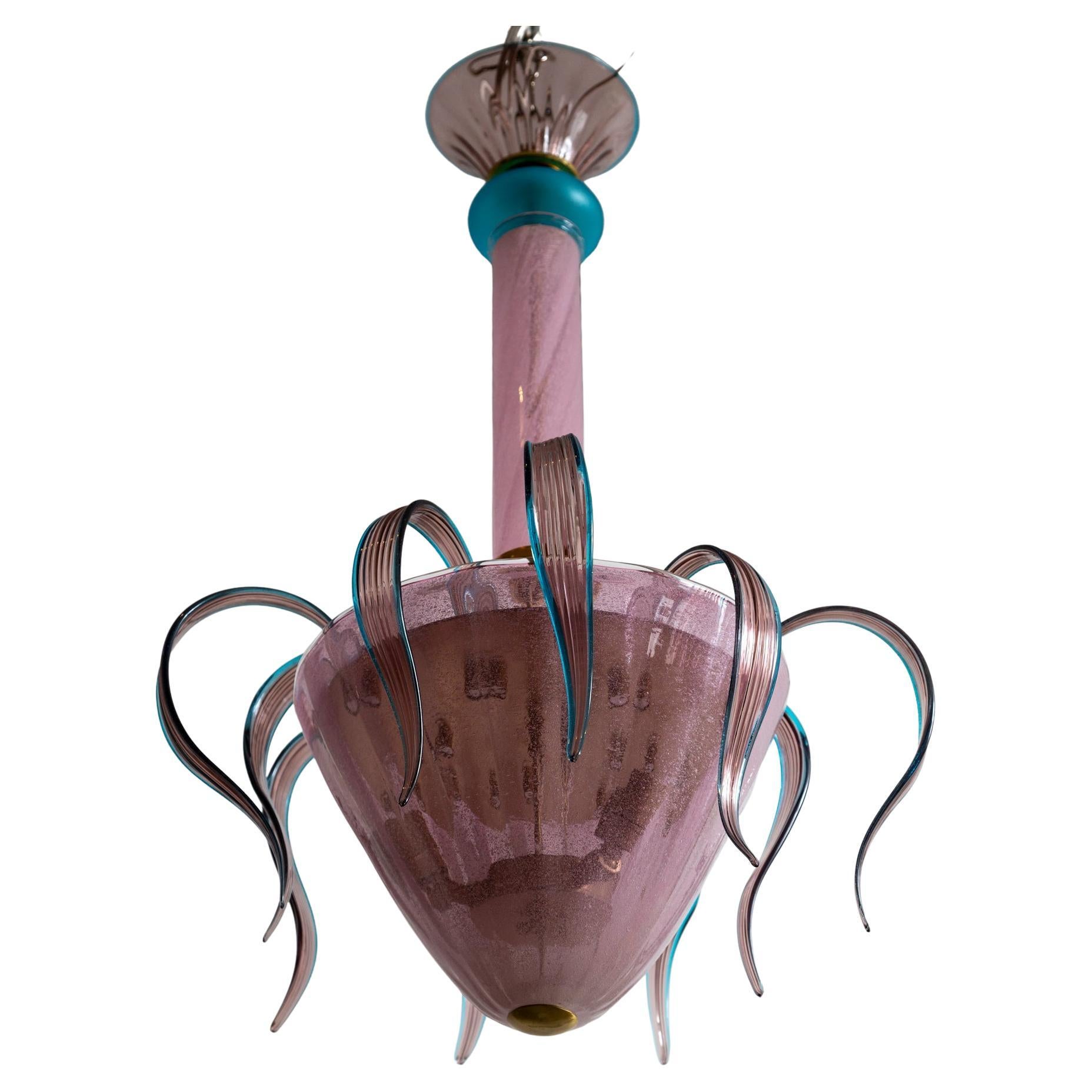 Whimsical Murano chandelier shown with ten cascading leaves in hues of plum and turquoise. While the fixture is composed of vintage glass the lamping and frame is recent 

The glass canopy may install directly flush to the ceiling or this fixture