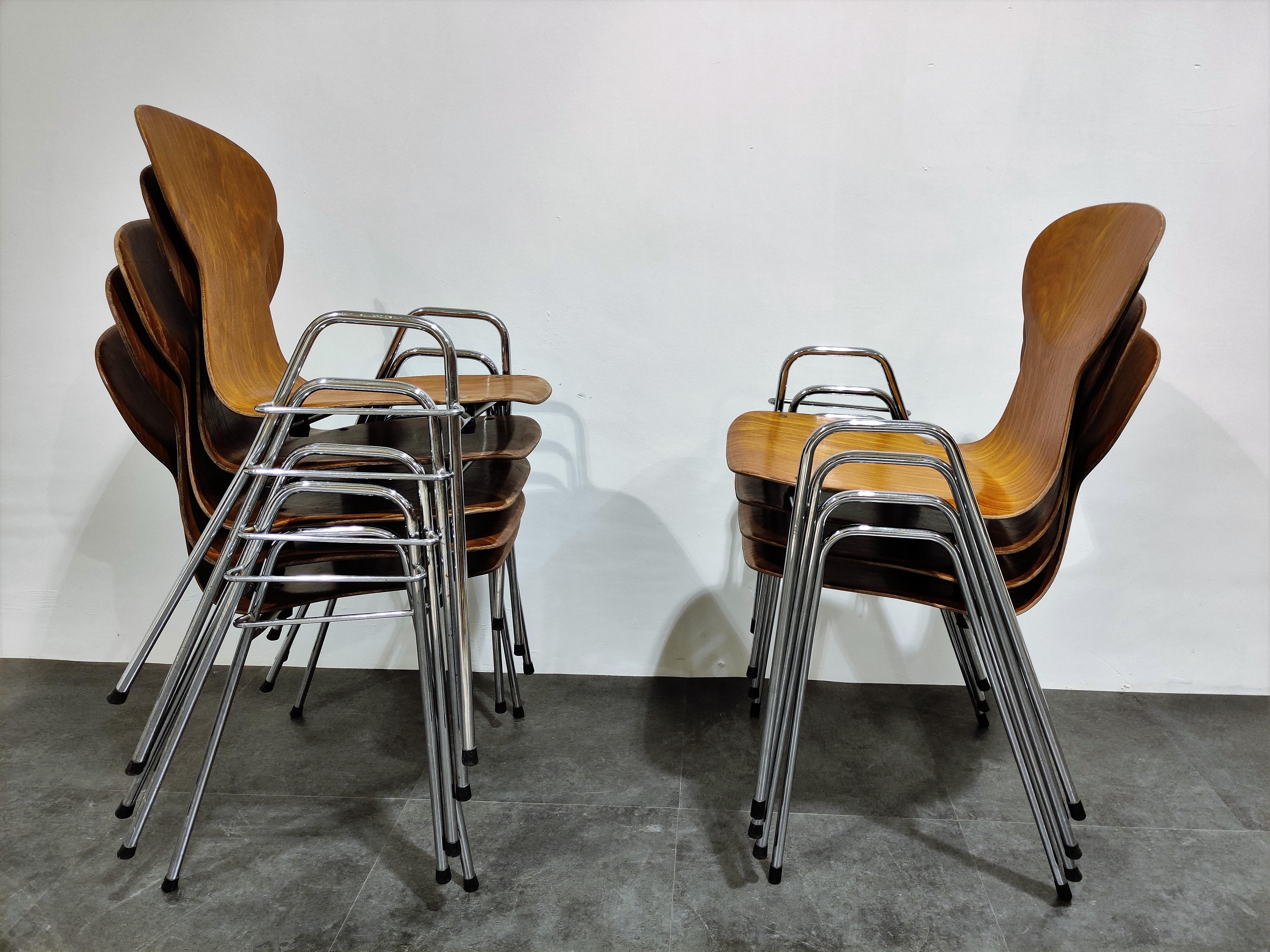 Set of 8 charming stackable plywood chairs by Tubax, Belgium.

Beautiful, elegant designed plywood seats on a fine chrome base.

The chairs can be attached to one another.

Very good condition
 
1980s, Belgium

Stamped