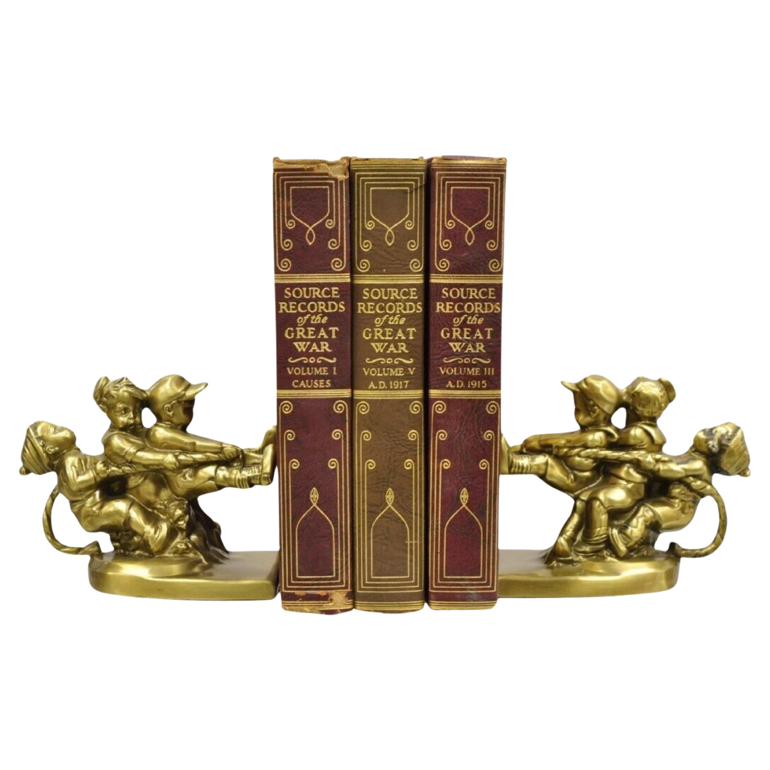 Vintage PM Craftsman "Tug of War" Brass Children Playing Figural Bookends - Pair For Sale