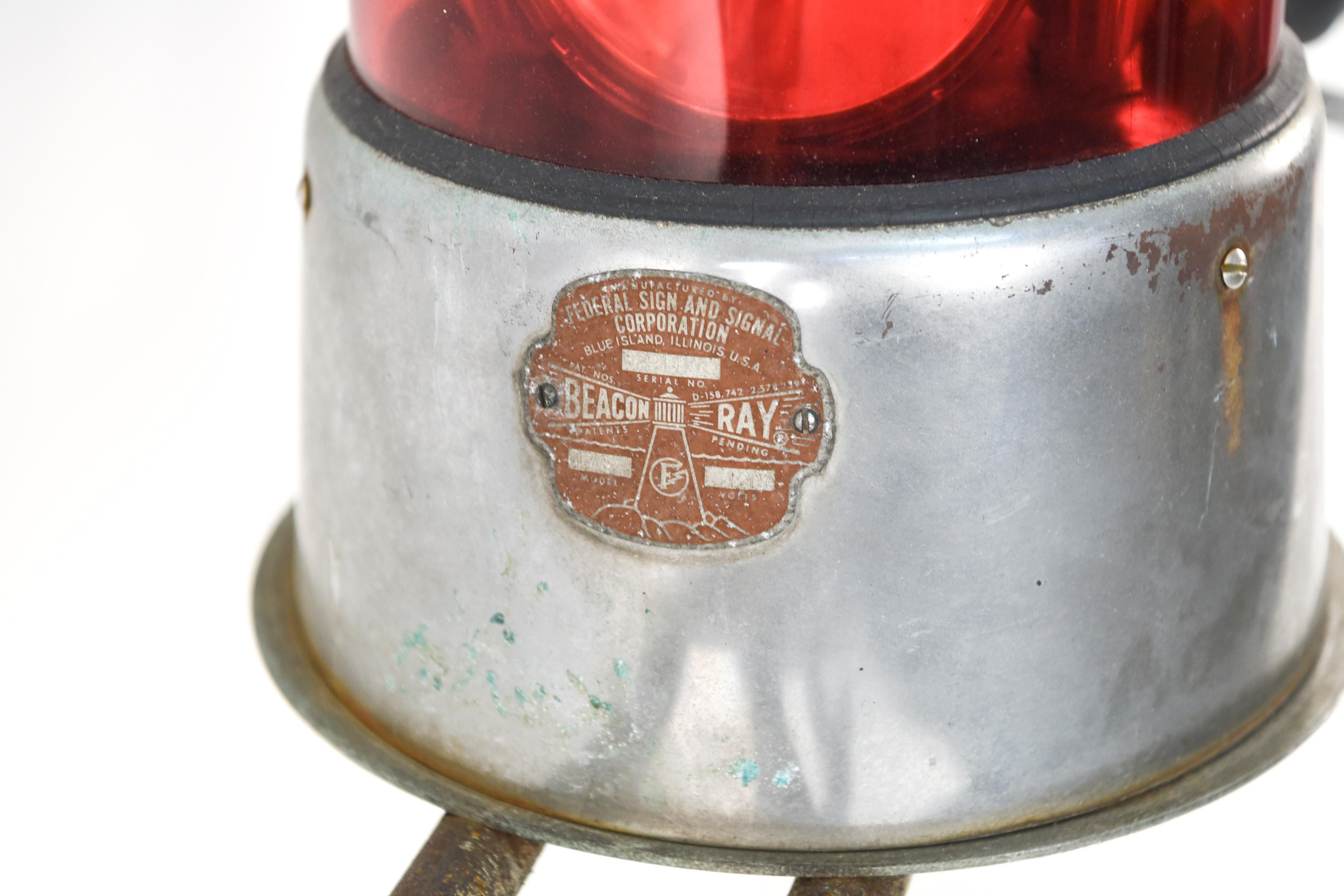 This vintage police siren and lights attachment would be a great movie prop or eye-catching decorative piece. Although not tested for functionality, this piece can stand alone as a piece of historical memorabilia that will provide an element of