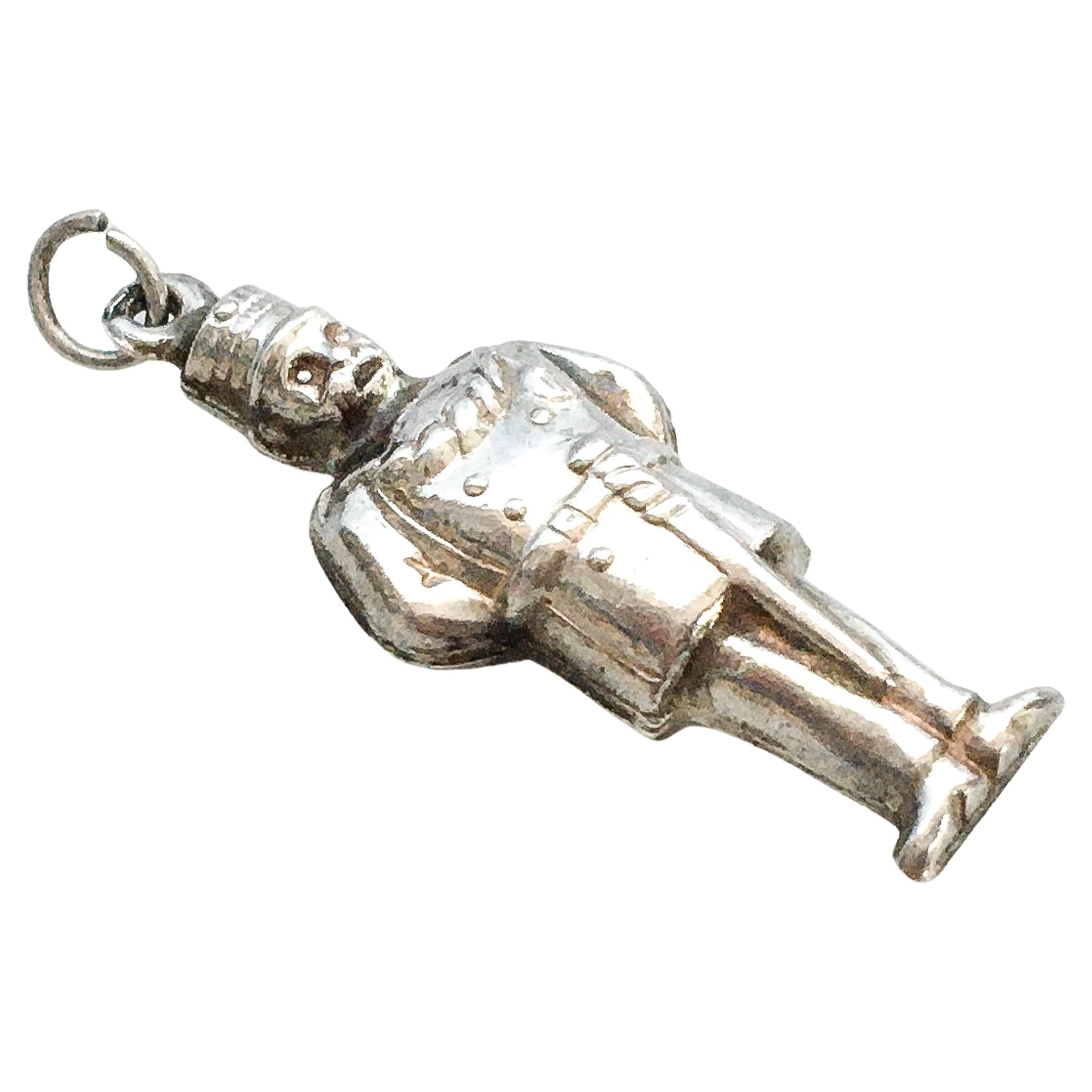 A three-dimensional vintage Dutch rural policeman charm pendant crafted in 835 silver. This officer is nicely detailed with his uniform, headgear and baton. The charm can be worn as an addition to your charms bracelet or alone as a pendant on a