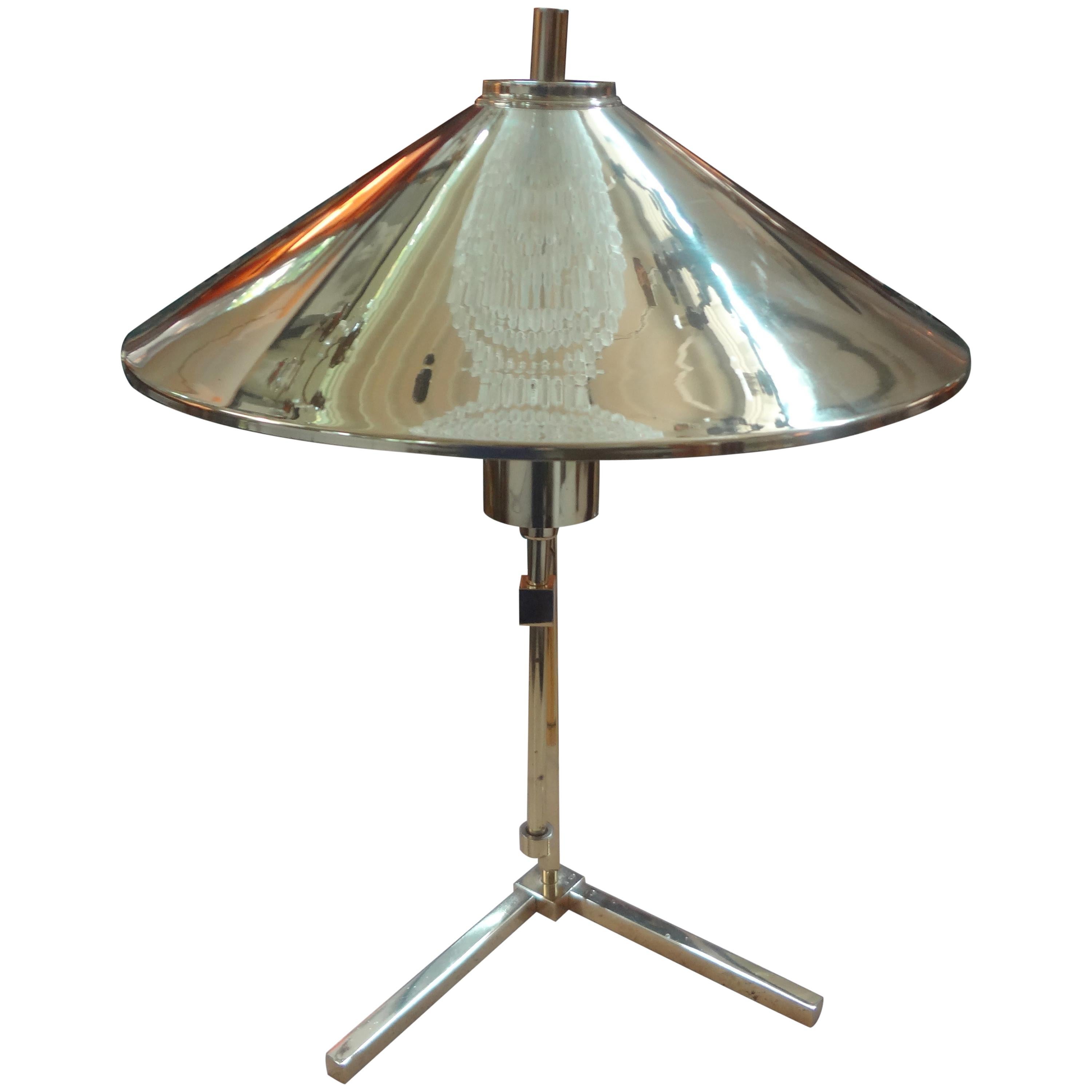 Interesting vintage Stilnovo style polished brass table lamp or desk lamp with a cone shaped brass shade. This interesting brass lamp would look great on a desk, writing table, bedside table or dressing room.