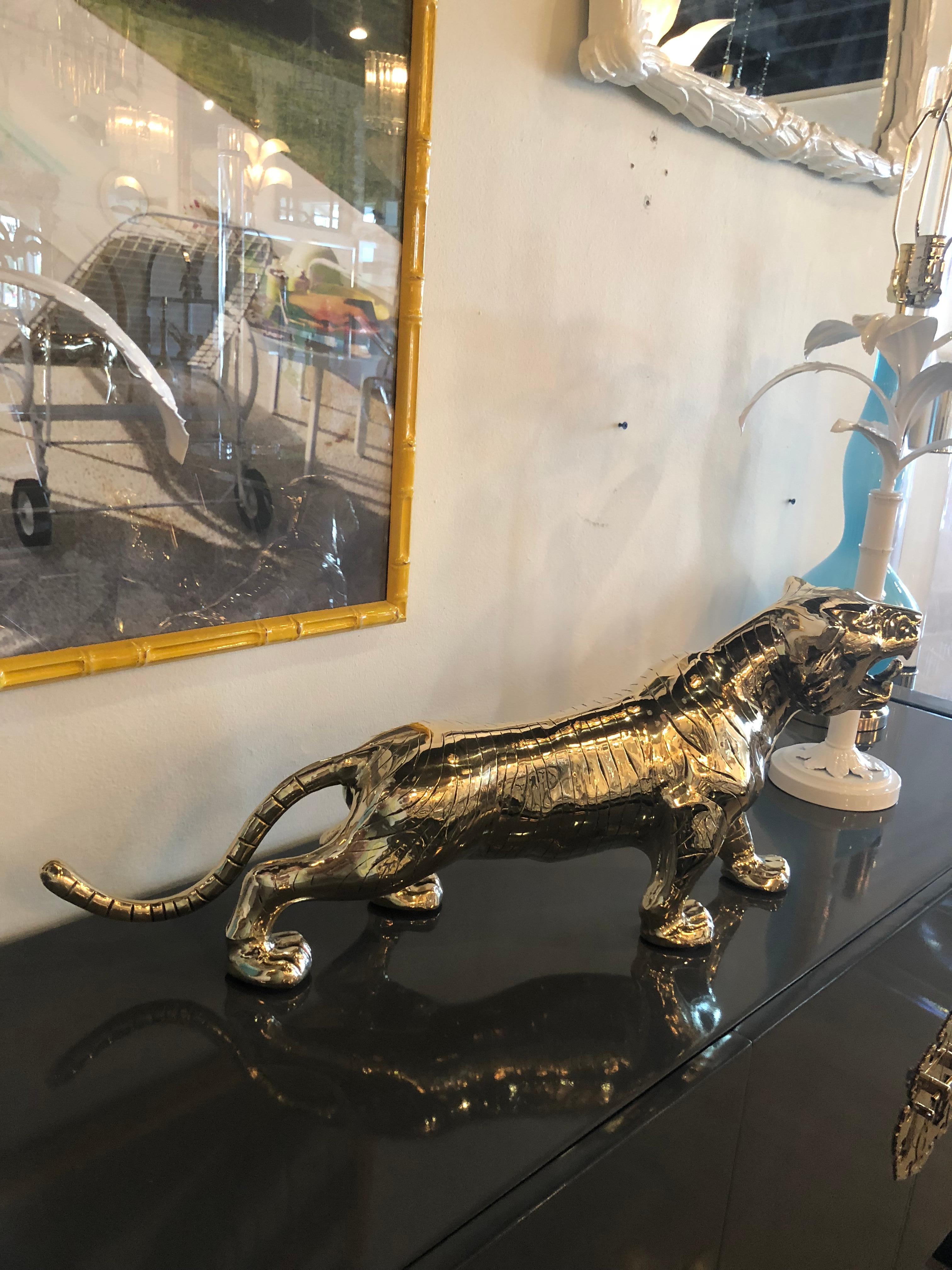 Beautiful vintage tiger statue in brass. This piece has been professionally polished for your home. There are two matching tigers available if you desire a pair.